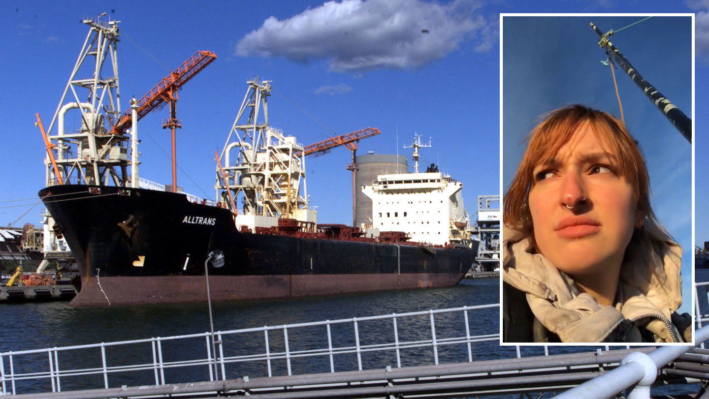 An activist has shut down coal operations at the Port of Newcastle by attaching herself to a bridge.