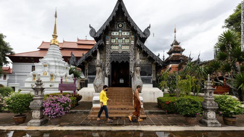 A monk walked through a near empty Wat Chedi Luang in Chiang Mai, Thailand. 