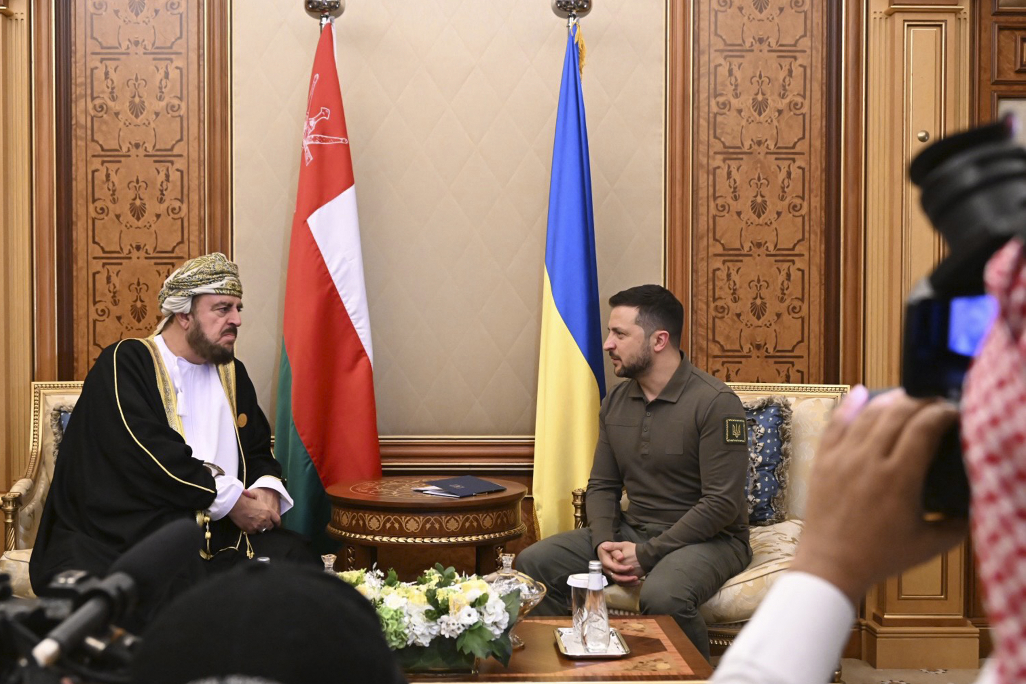 Ukraine's President Volodymyr Zelenskyy, right, meets with Asaad bin Tariq bin Taimur Al Said, Deputy Prime Minister of Oman Sultanate during the Arab summit in Jeddah, Saudi Arabia, Friday, May 19, 2023.  