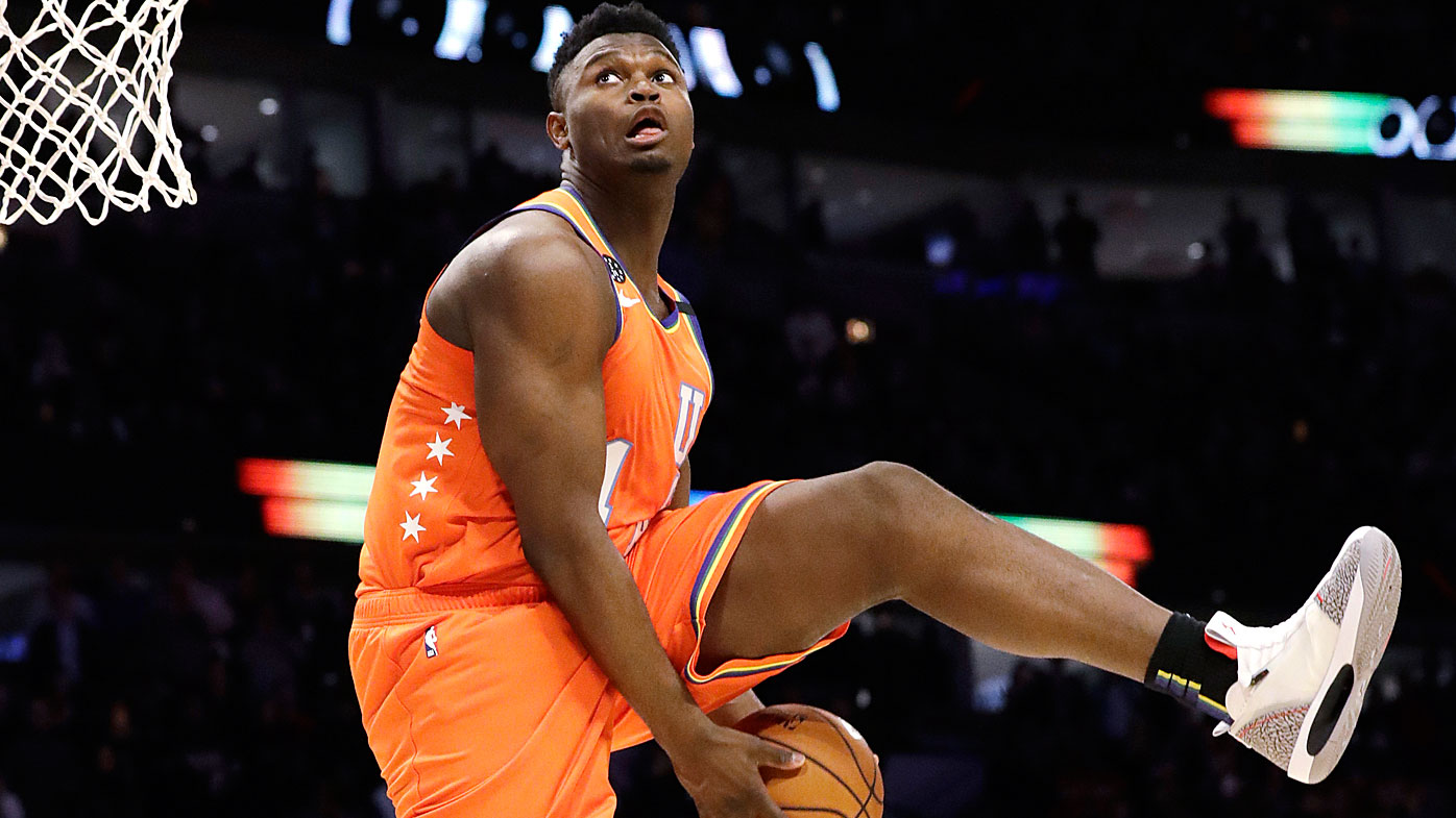  Zion Williamson, of the New Orleans Pelicans, goes up for a dunk during the second half of the NBA Rising Stars basketball game