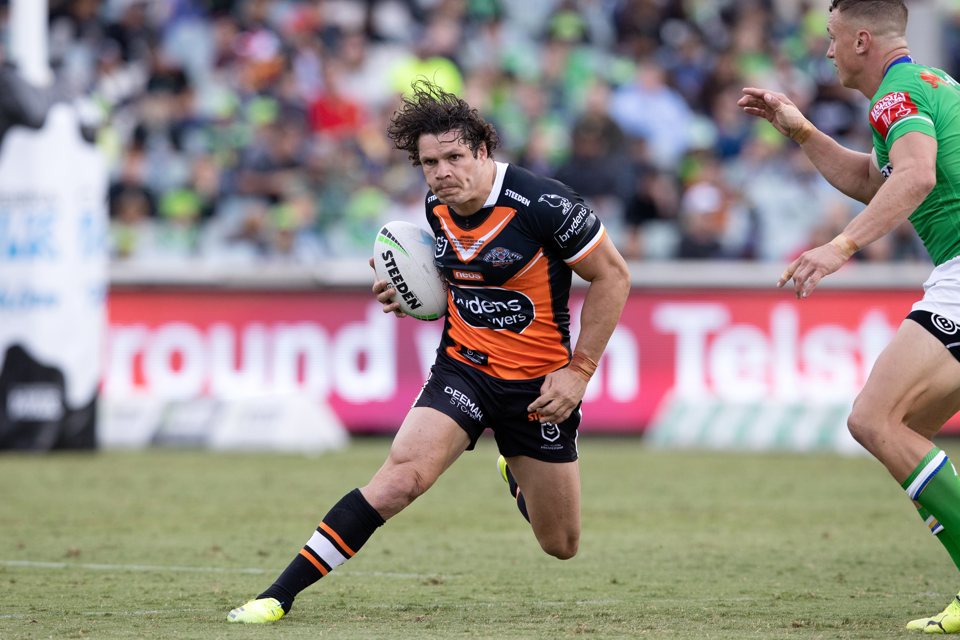 James Roberts on the attack for Wests Tigers.