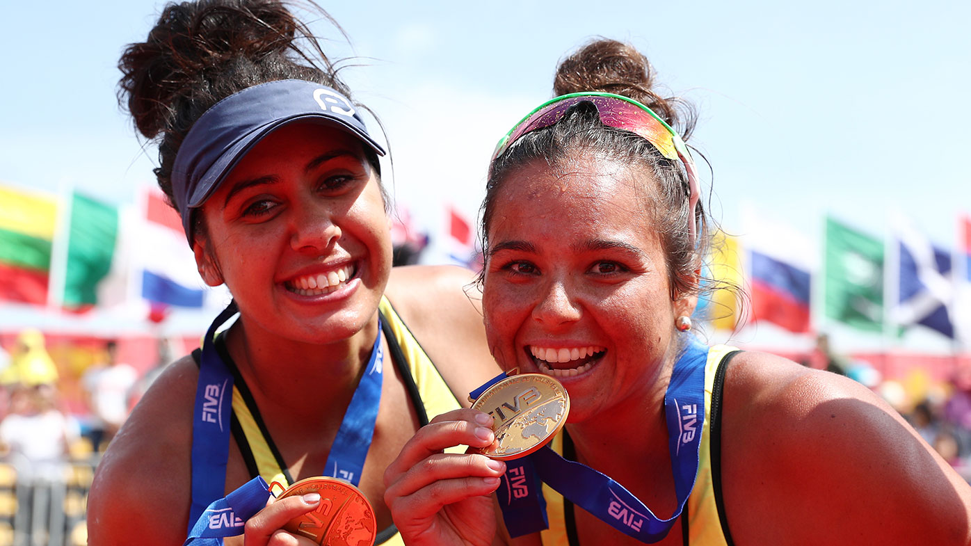 Mariafe Artacho(R) and Taliqua Clancy of Australia celebrate with their medal after winning the final match against Kinga Kolosinska and Katarzyna Kociolek of Poland on Day 5 of FIVB Beach Volleyball World Tour Qinzhou Openon October 15, 2017 in Qinzhou, China. (Photo by Zhong Zhi/Getty Images)