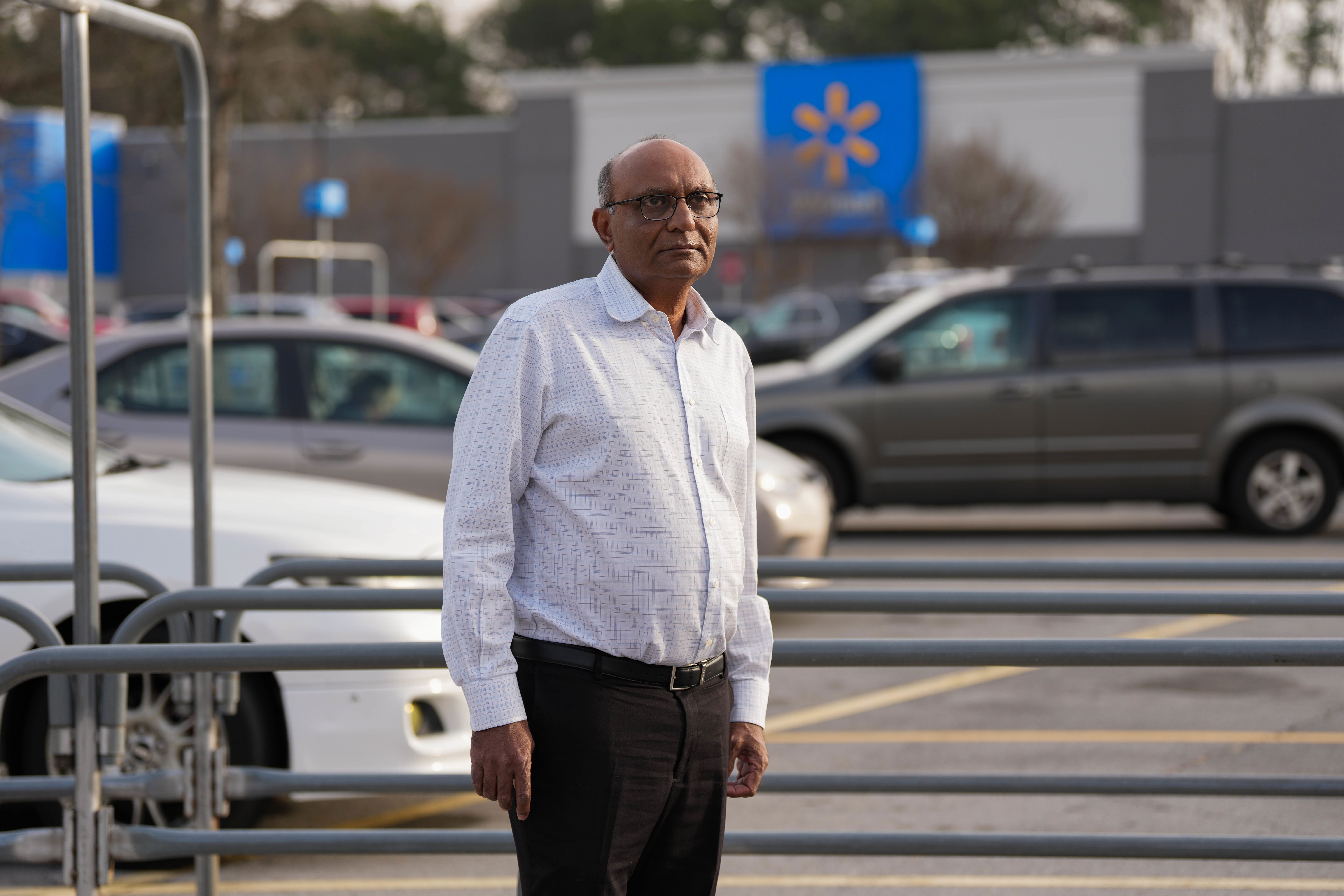 Mahendra "Mick" Patel stands outside a Walmart store in Kennesaw, Georgia on December 17.
