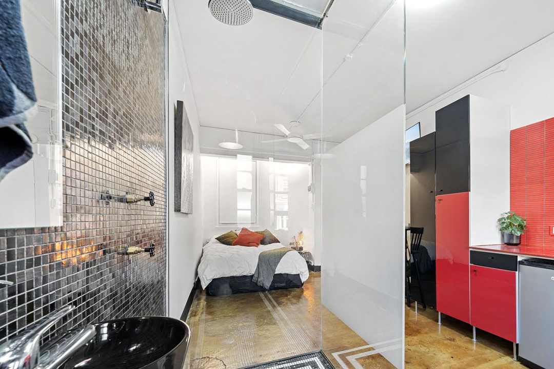 Tiny studio flat with toilet seat in the kitchen finds a tenant