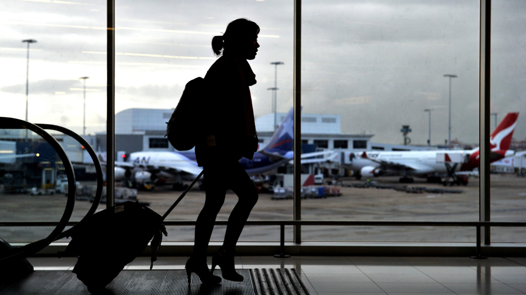 A passenger walks through the international terminal at Sydney Airport. (AAP stock)