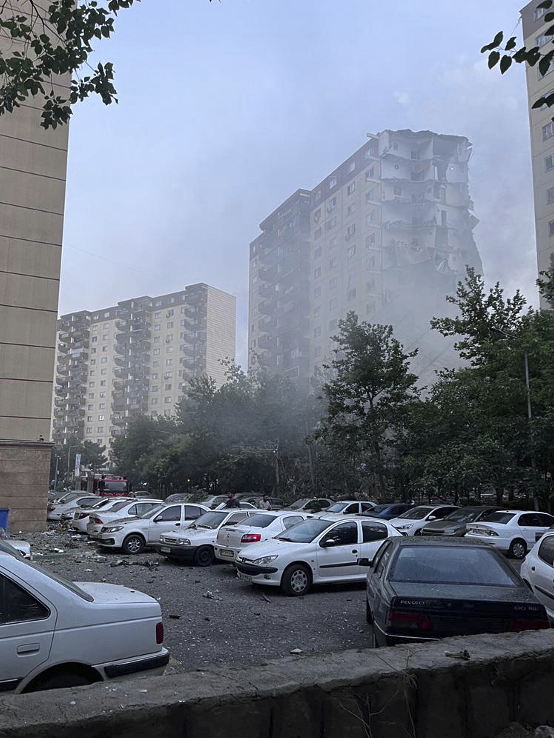 Smoke rises from a damaged building in Tehran, Iran. Israel attacked Iran's capital early Friday, with explosions booming across Tehran.