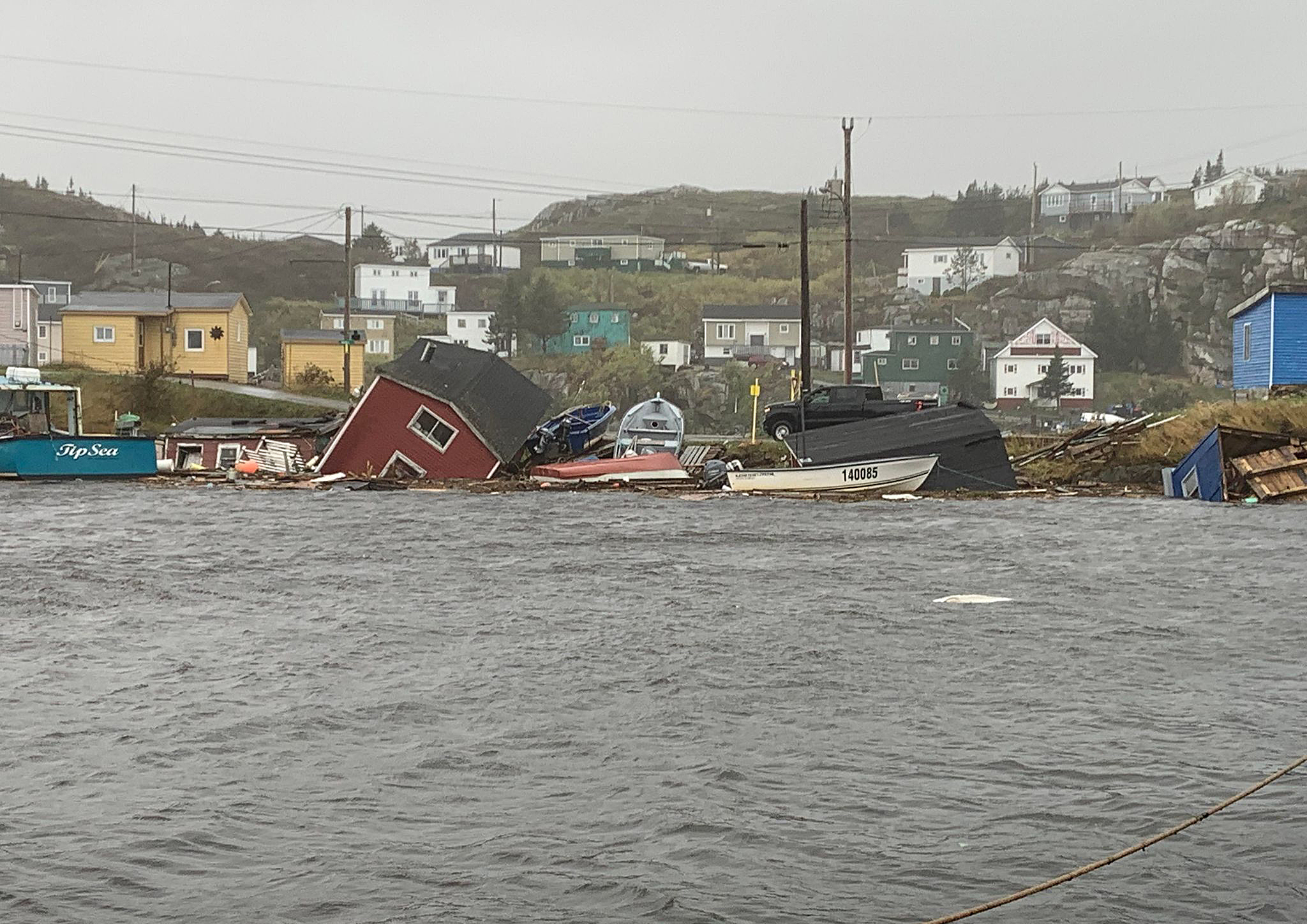 This photo provided by Pauline Billard shows destruction caused by Hurricane Fiona in Rose Blanche, 45 kilometers (28 miles) east of Port aux Basques, Newfoundland and Labrador, Saturday, Sept. 24, 2022. (Pauline Billard via AP)