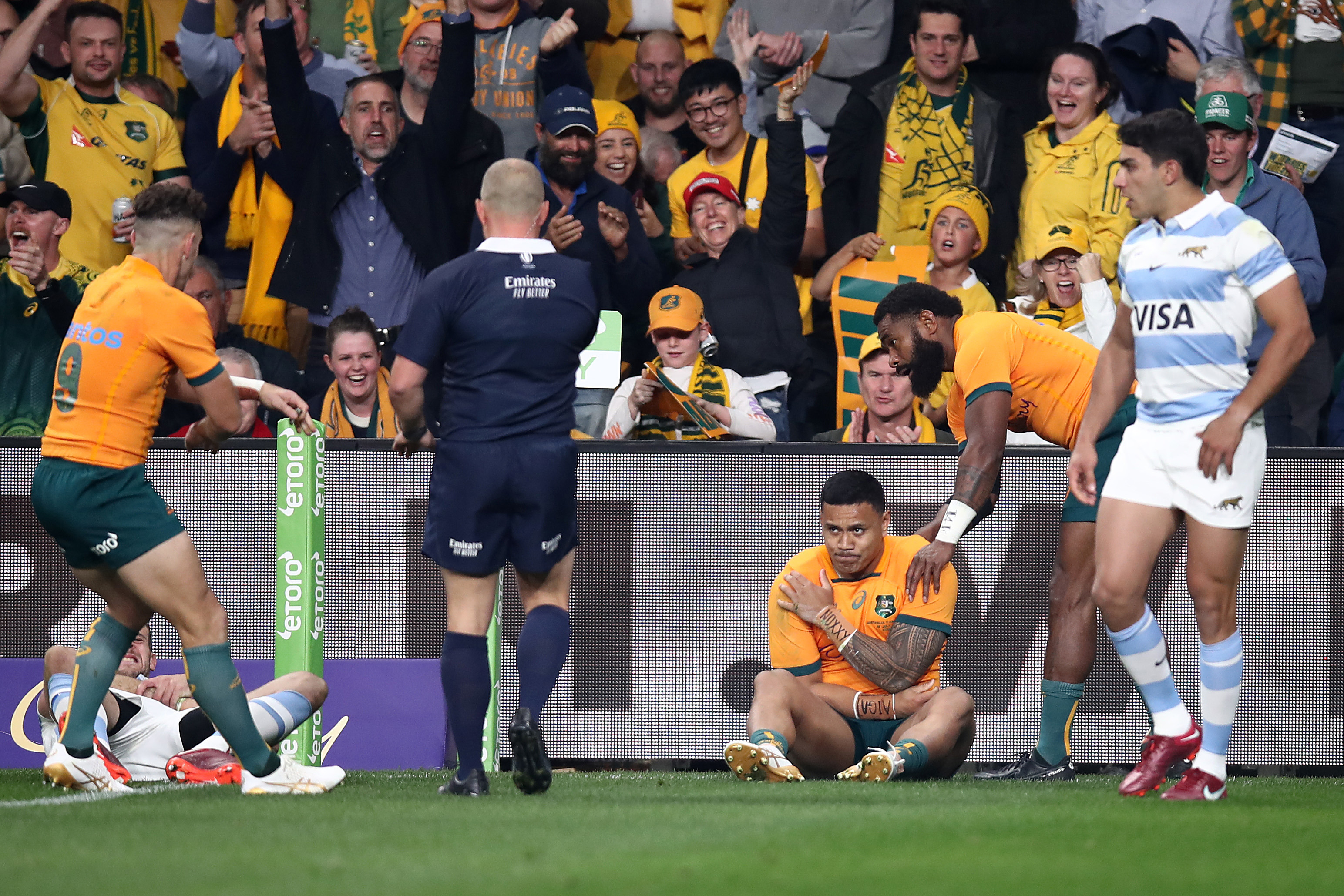 Len Ikitau of the Wallabies holds his shoulder after scoring a try during the Rugby Championship match between the Australia and Argentina.