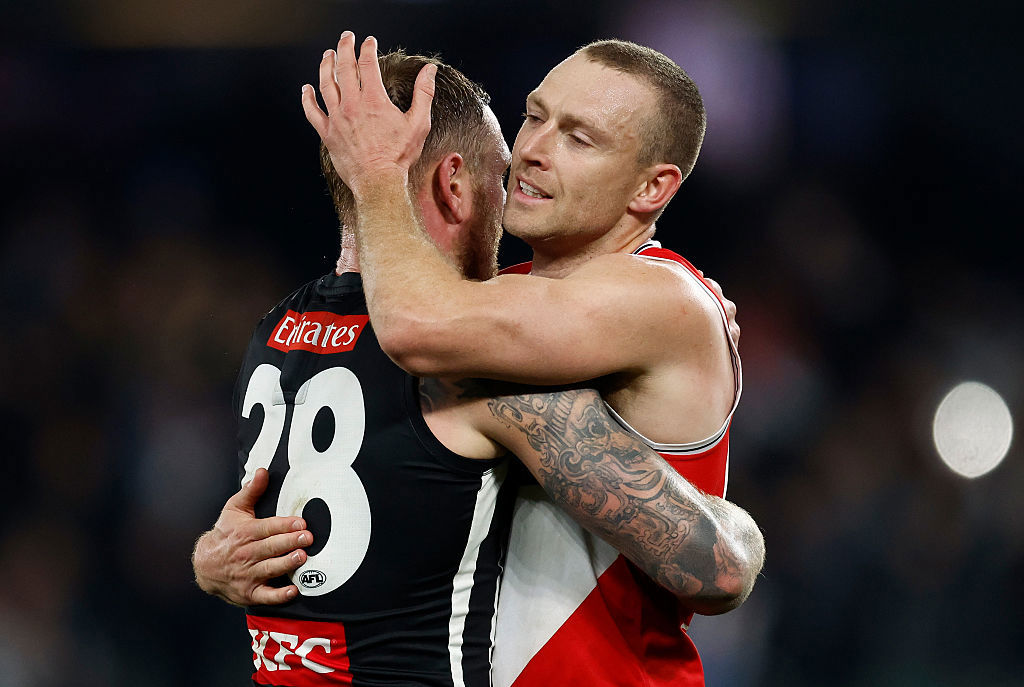 Tim Membrey of the Magpies and Callum Wilkie of the Saints embrace.