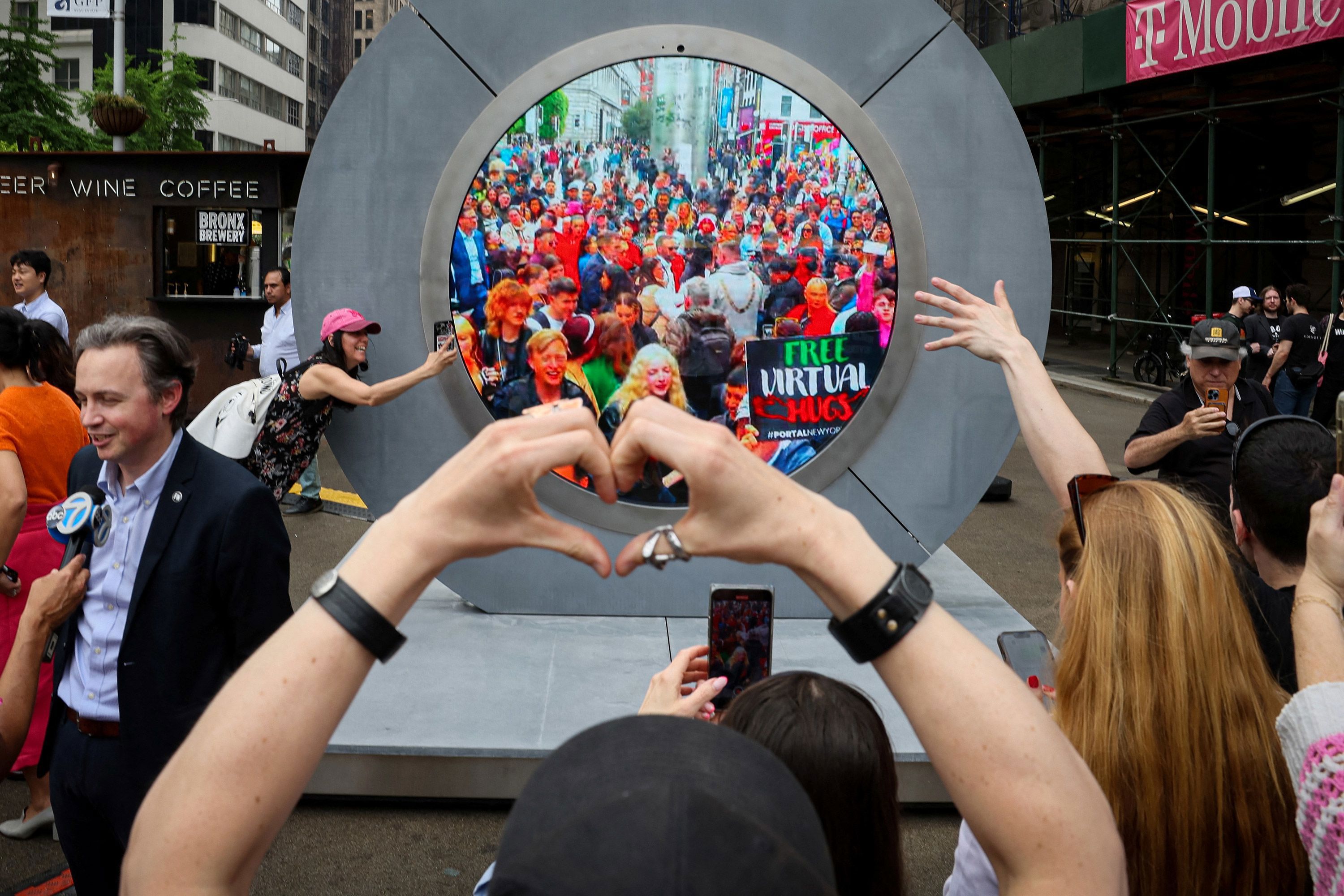 New Yorkers greet people in Dublin during the reveal of New York City's Portal on May 8.