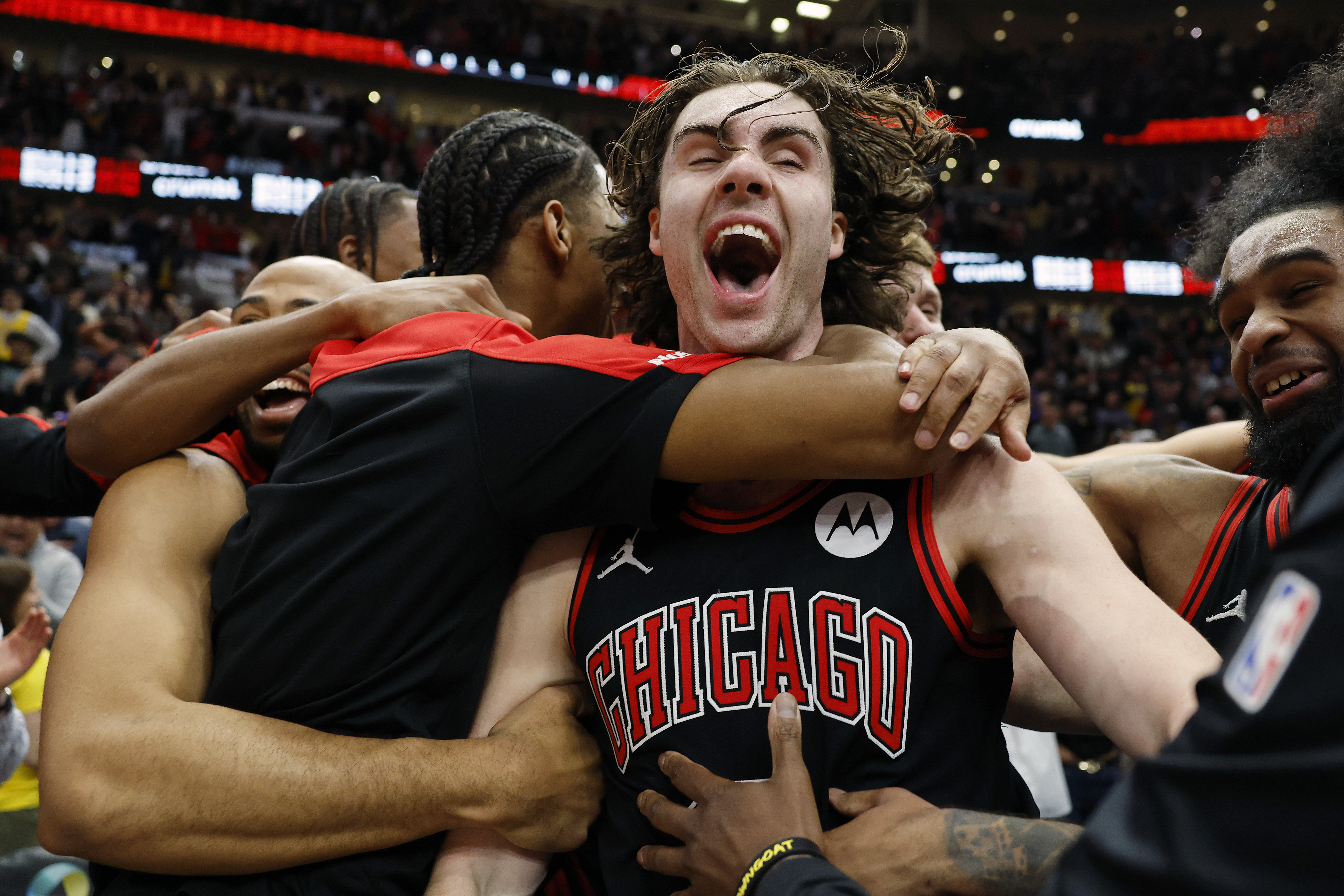 Josh Giddey of the Chicago Bulls celebrates with teammates.