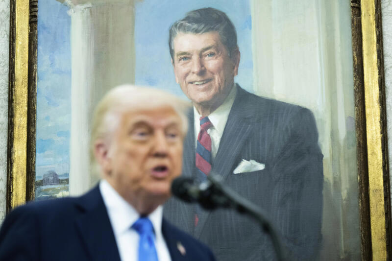 With a painting of former President Ronald Reagan behind him, President Donald Trump speaks during a swearing in ceremony for Alina Habba as interim US Attorney General for New Jersey, in the Oval Office of the White House in Washington