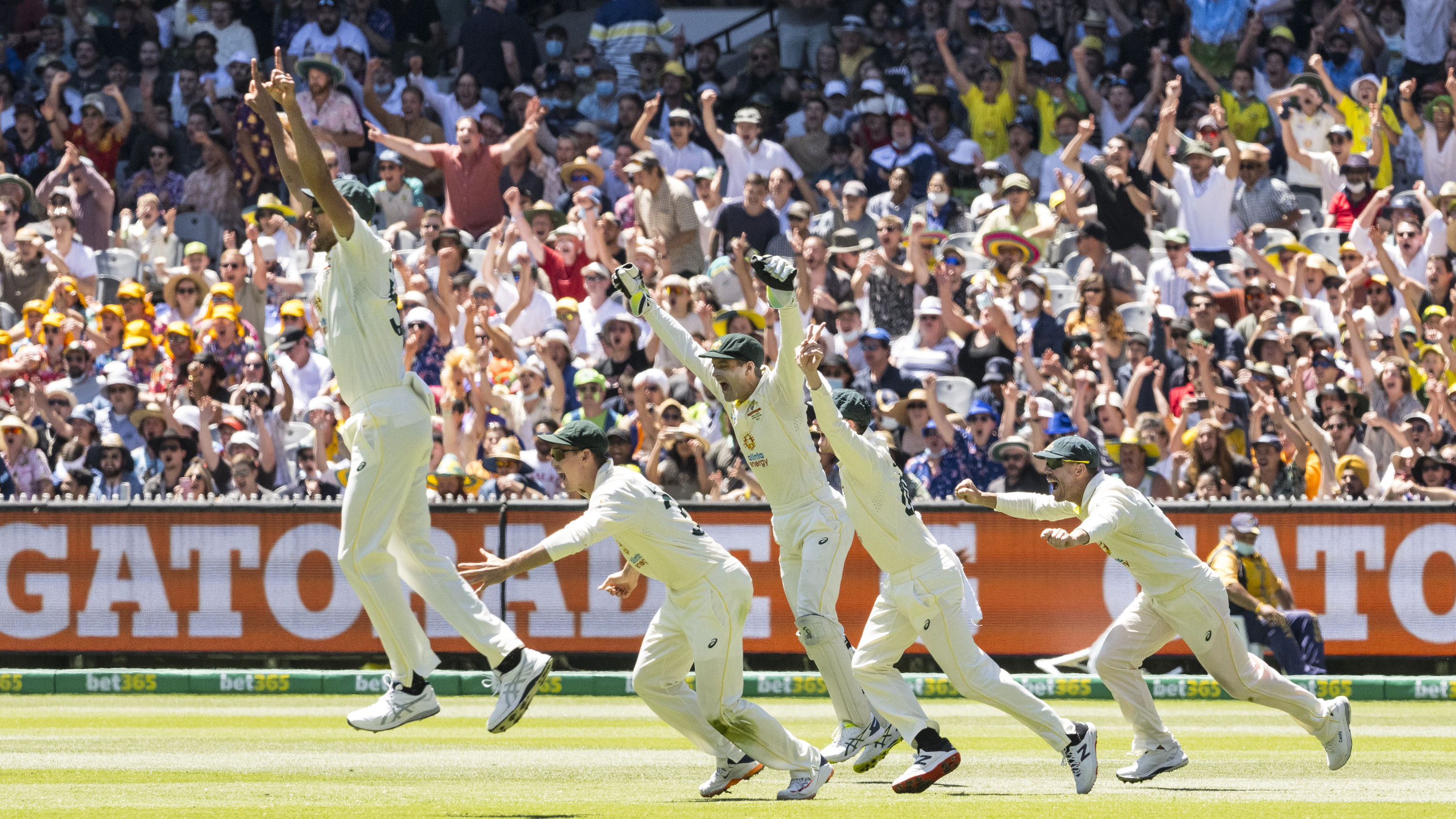 The Australian team celebrates after winning the match and retaining the Ashes on day 3 of the Boxing Day test match at the MCG in Melbourne.