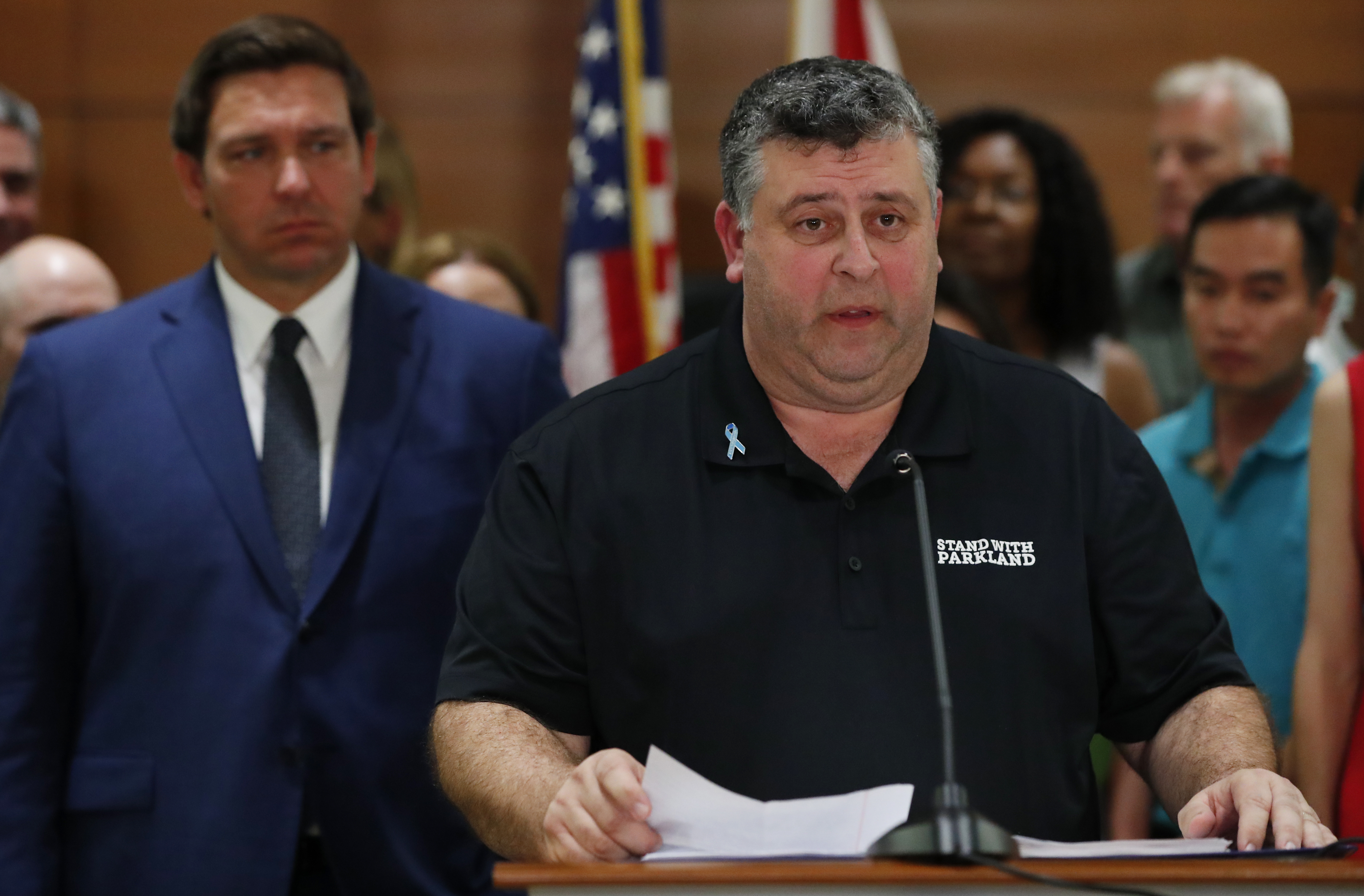 Tony Montalto, father of Gina Montalto, who was killed during the Parkland school shooting, speaks as Florida governor Ron DeSantis, left, looks on during a news conference. 
