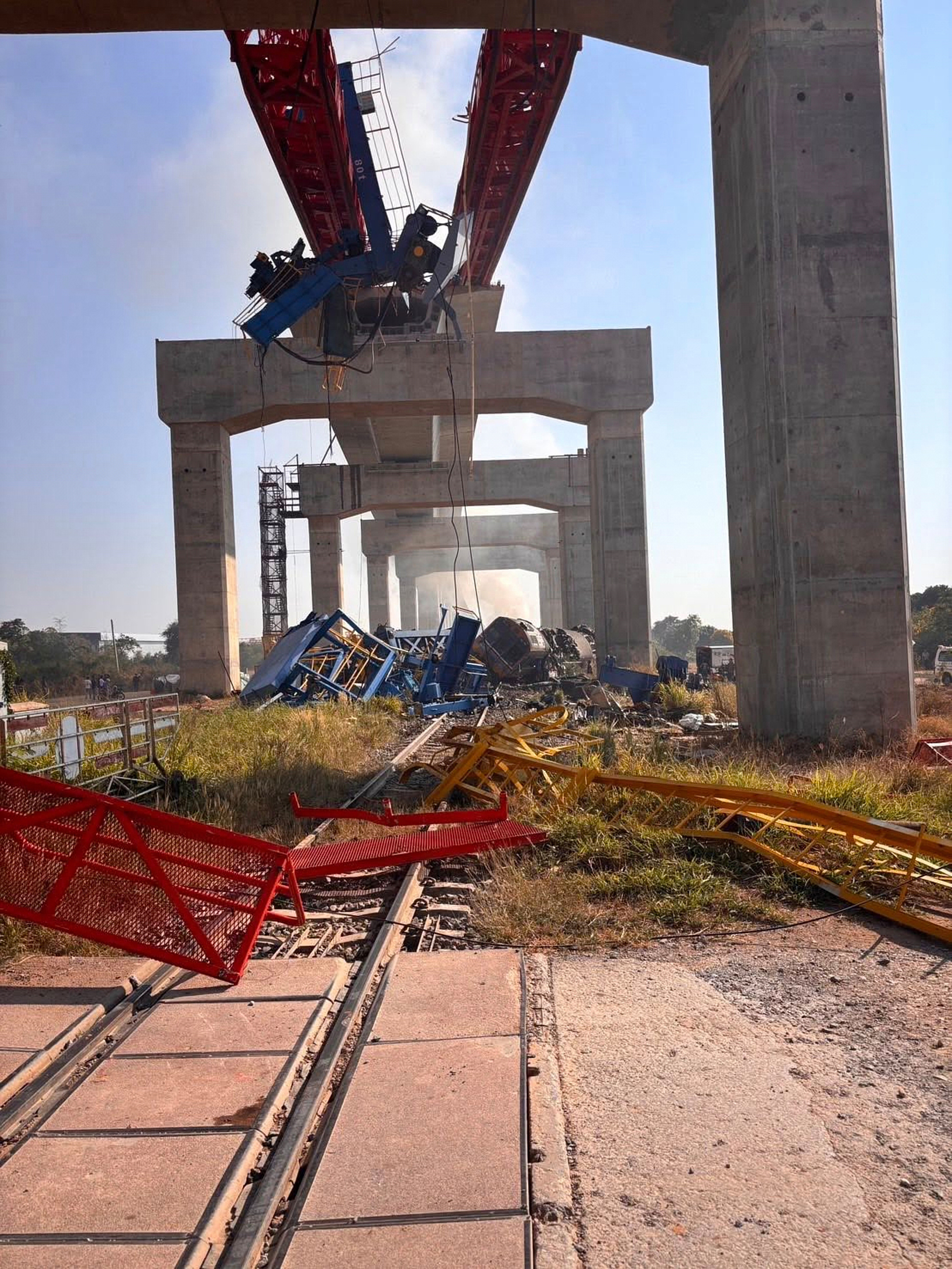 This photo released from State Railway of Thailand, shows a scene after a construction crane fell into a passenger train in Nakhon Ratchasima province, Thailand Wednesday, Jan. 14, 2026. (State Railway of Thailand via AP)