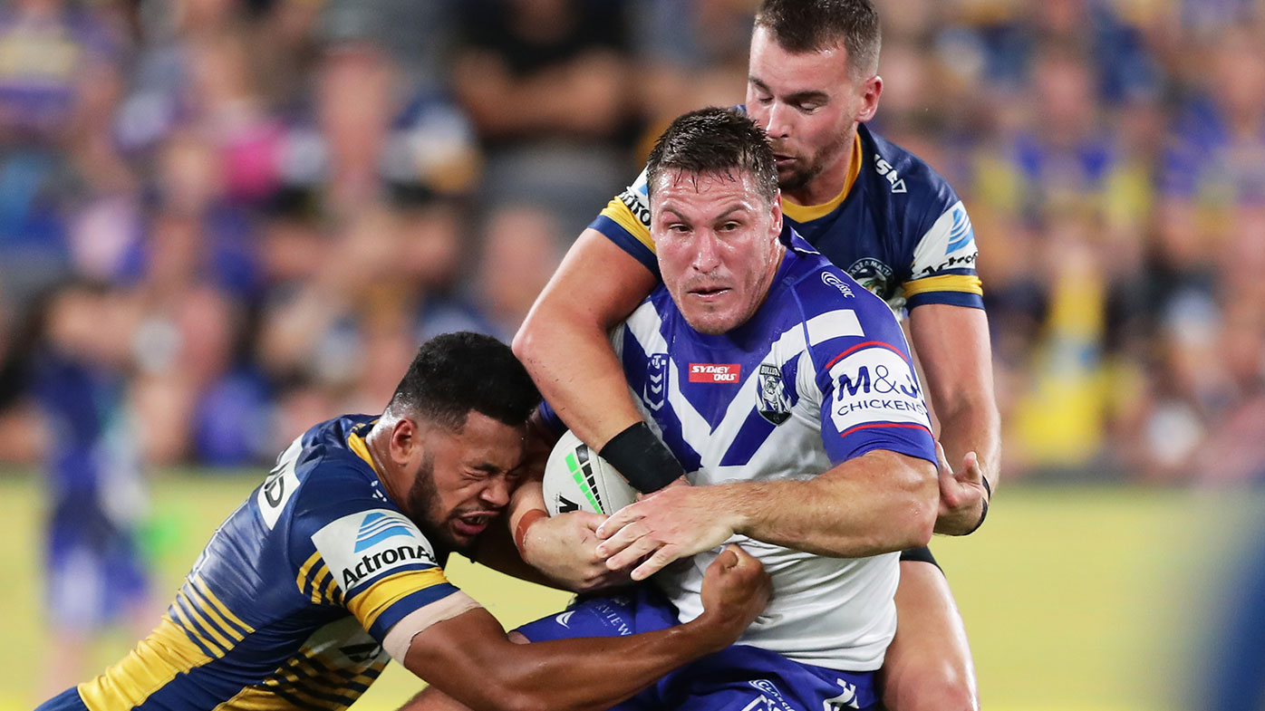 Josh Jackson of the Bulldogs is tackled during the round 1 NRL match between the Parramatta Eels and the Canterbury Bulldogs