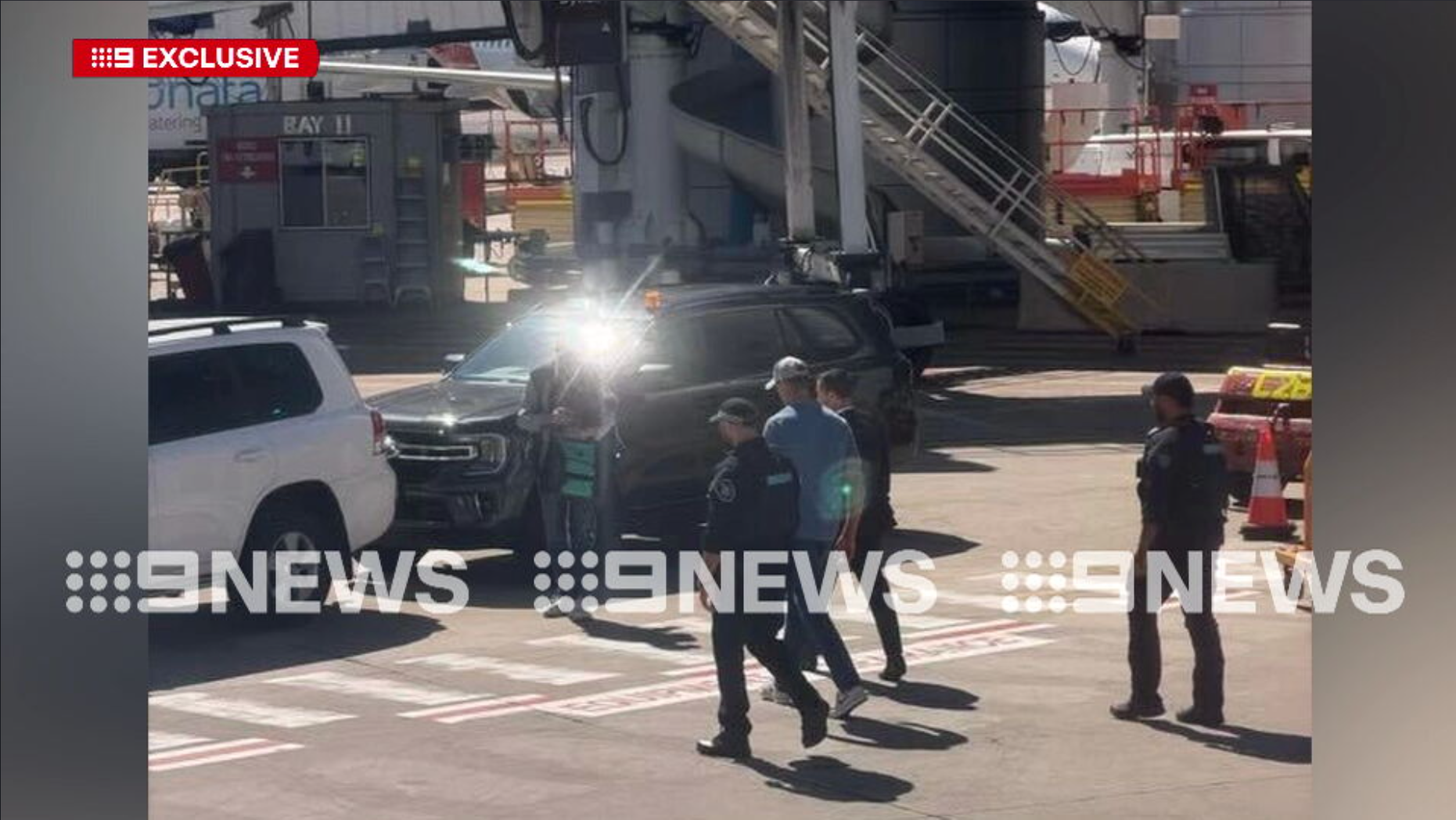 Nine News captured footage of Ben Roberts-Smith being led into a waiting car on the tarmac of Sydney Airport.