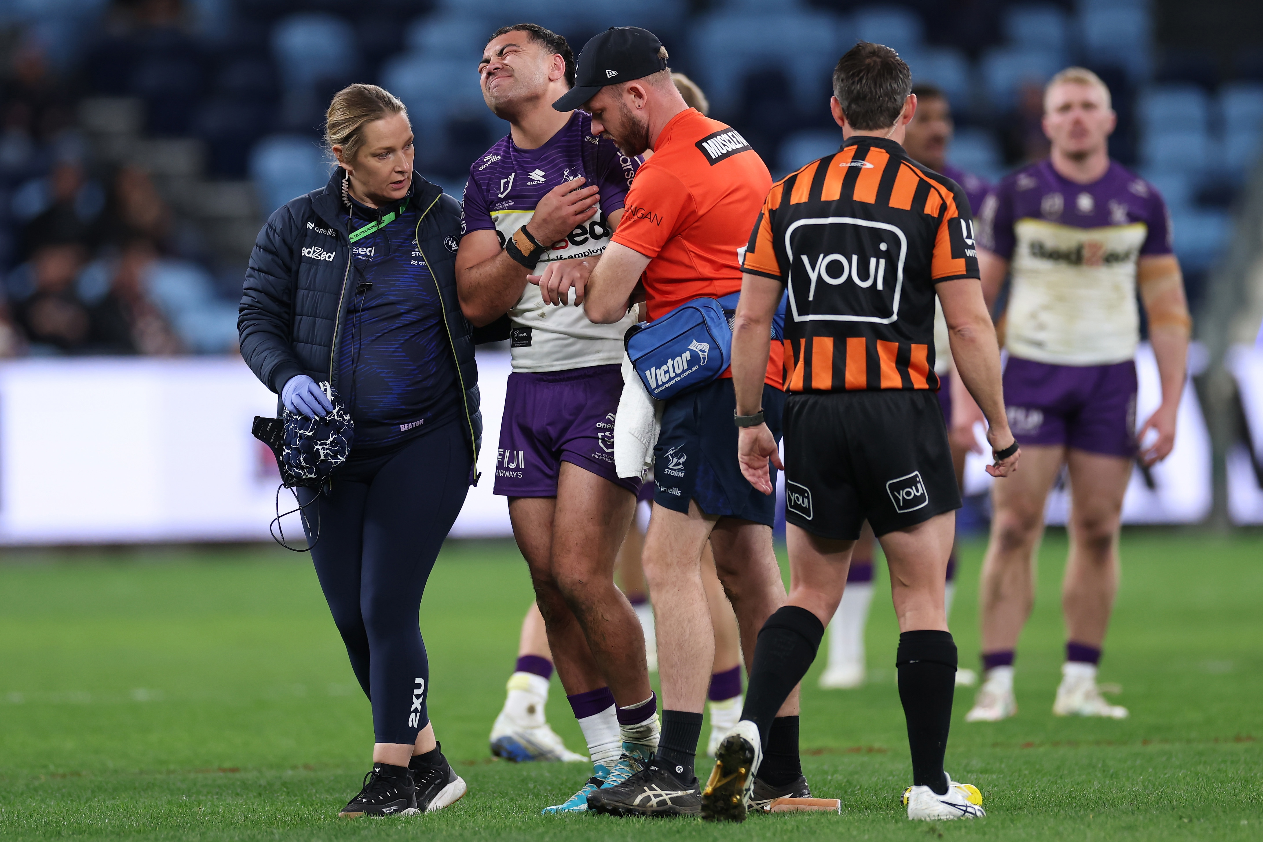 Jahrome Hughes leaves the field injured against the Roosters.
