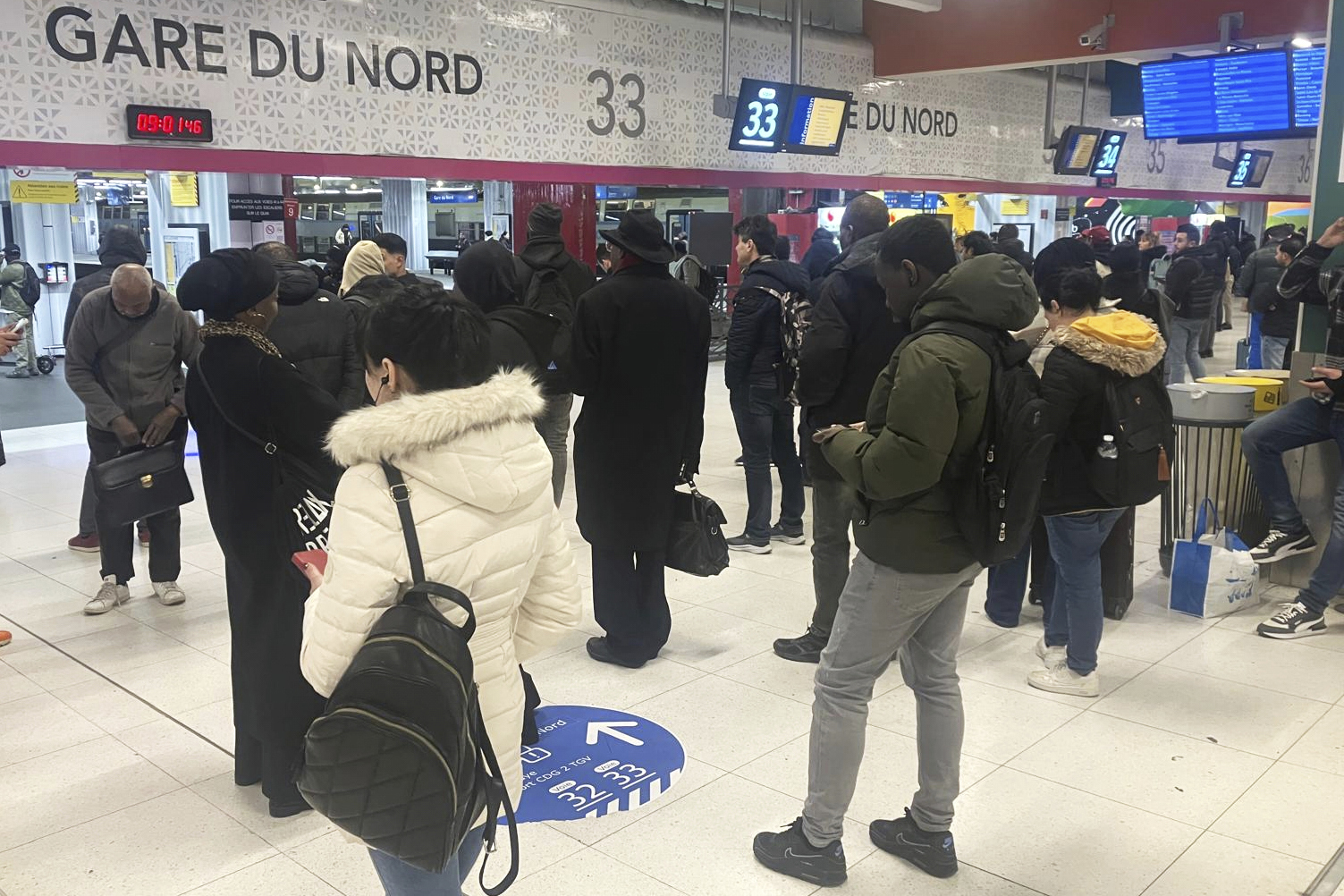 Passengers wait as Eurostar trains to London and all trains heading to northern France have been brought to a halt