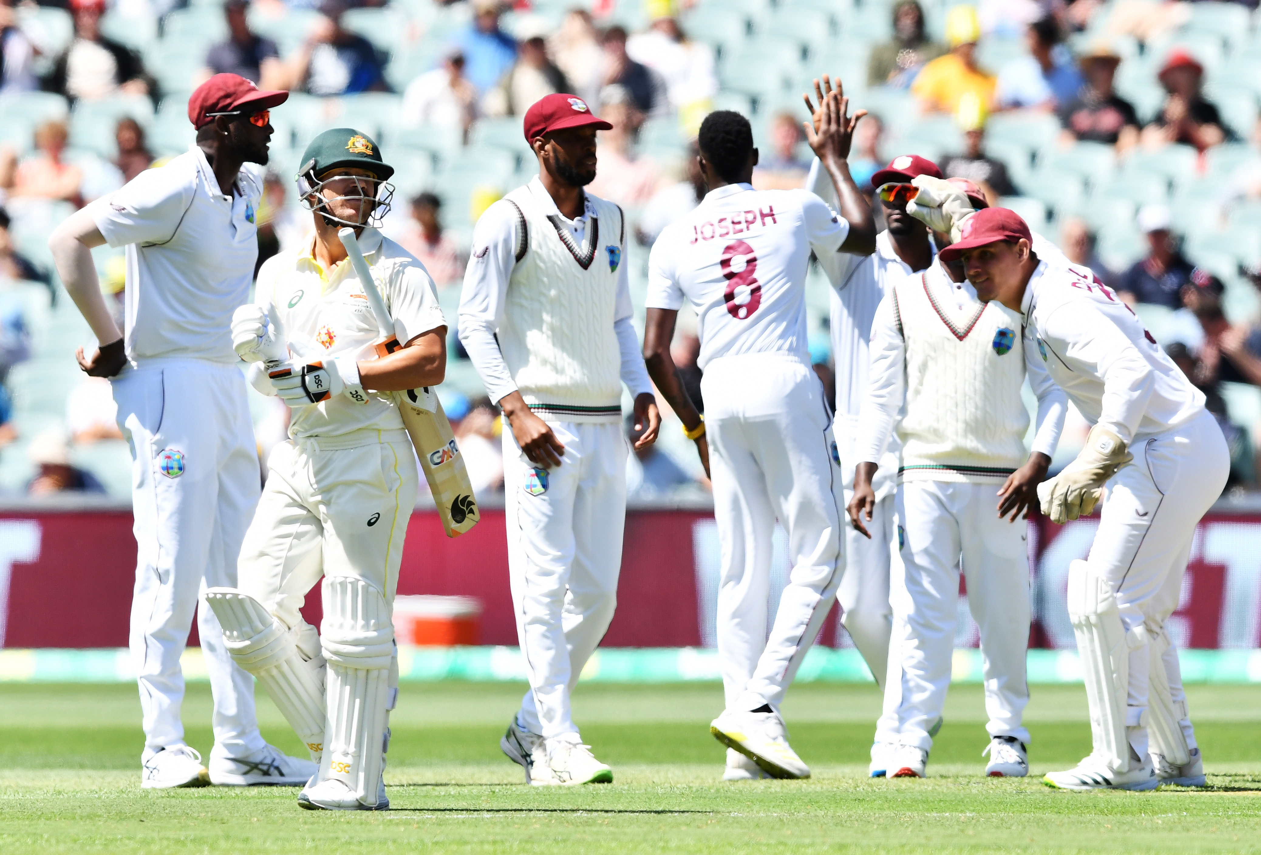 David Warner  of Australia leaves the ground after getting out to Alzarri Joseph of West Indies  during day one of the Second Test Match in the series between Australia and the West Indies at Adelaide Oval on December 08, 2022 in Adelaide, Australia. (Photo by Mark Brake - CA/Cricket Australia via Getty Images)