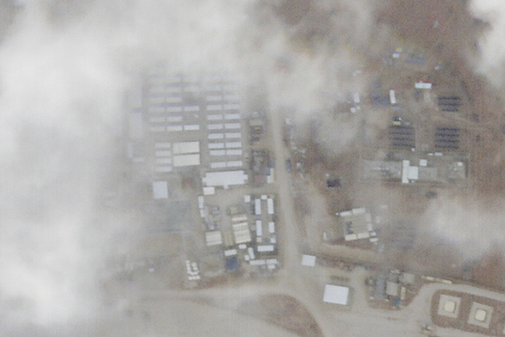 A satellite photo from Planet Labs PBC shows a military base known as Tower 22 in northeastern Jordan on Monday, Jan. 29, 2024. A satellite image taken Monday of the Jordanian base targeted by a bomb-carrying drone that killed three U.S. soldiers appears to show damage at the site. The damage can be seen in the centre left of the photo.