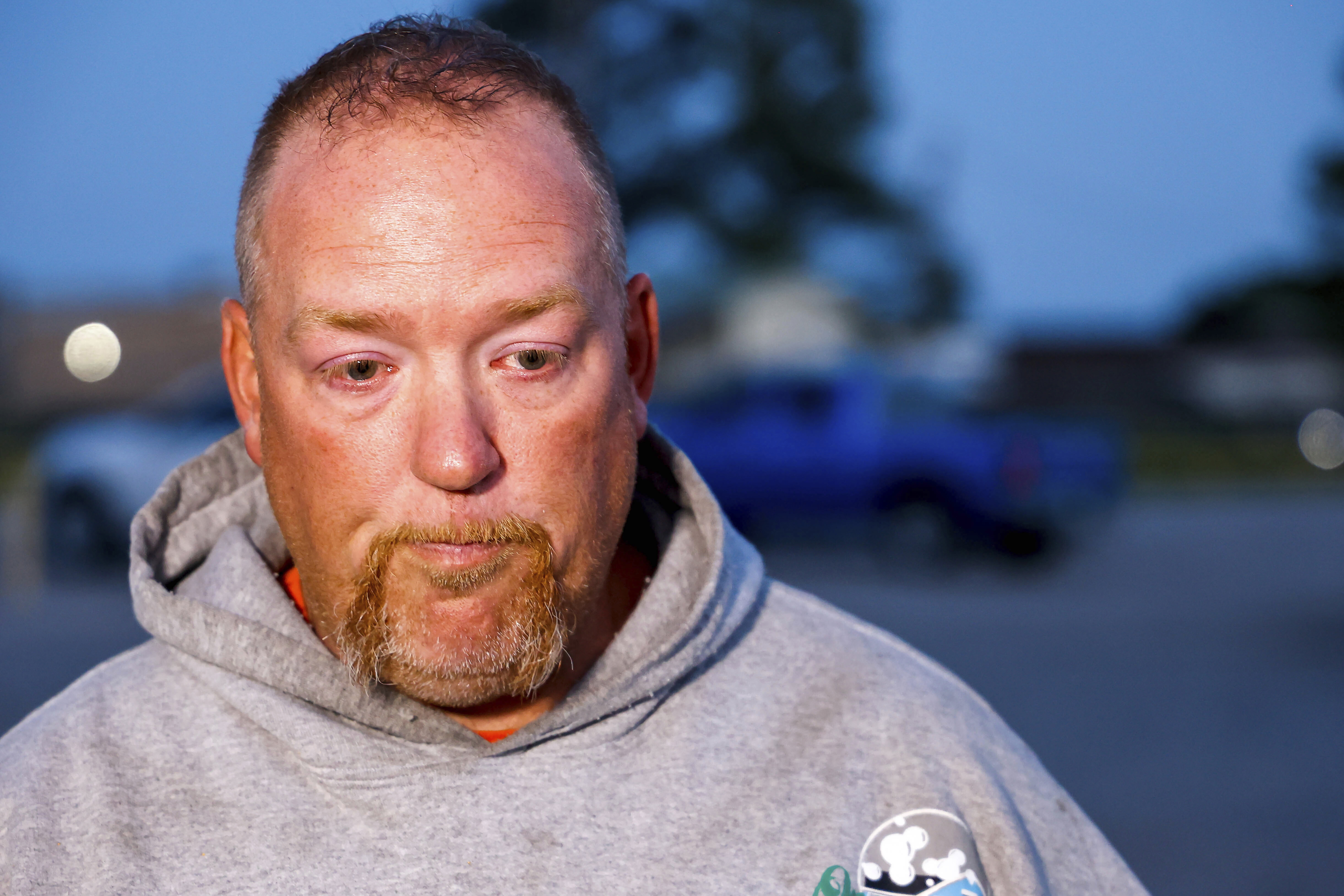 Nathan Brewer, the father of Brittany Brewer who was found dead, speaks after a vigil in Henryetta.