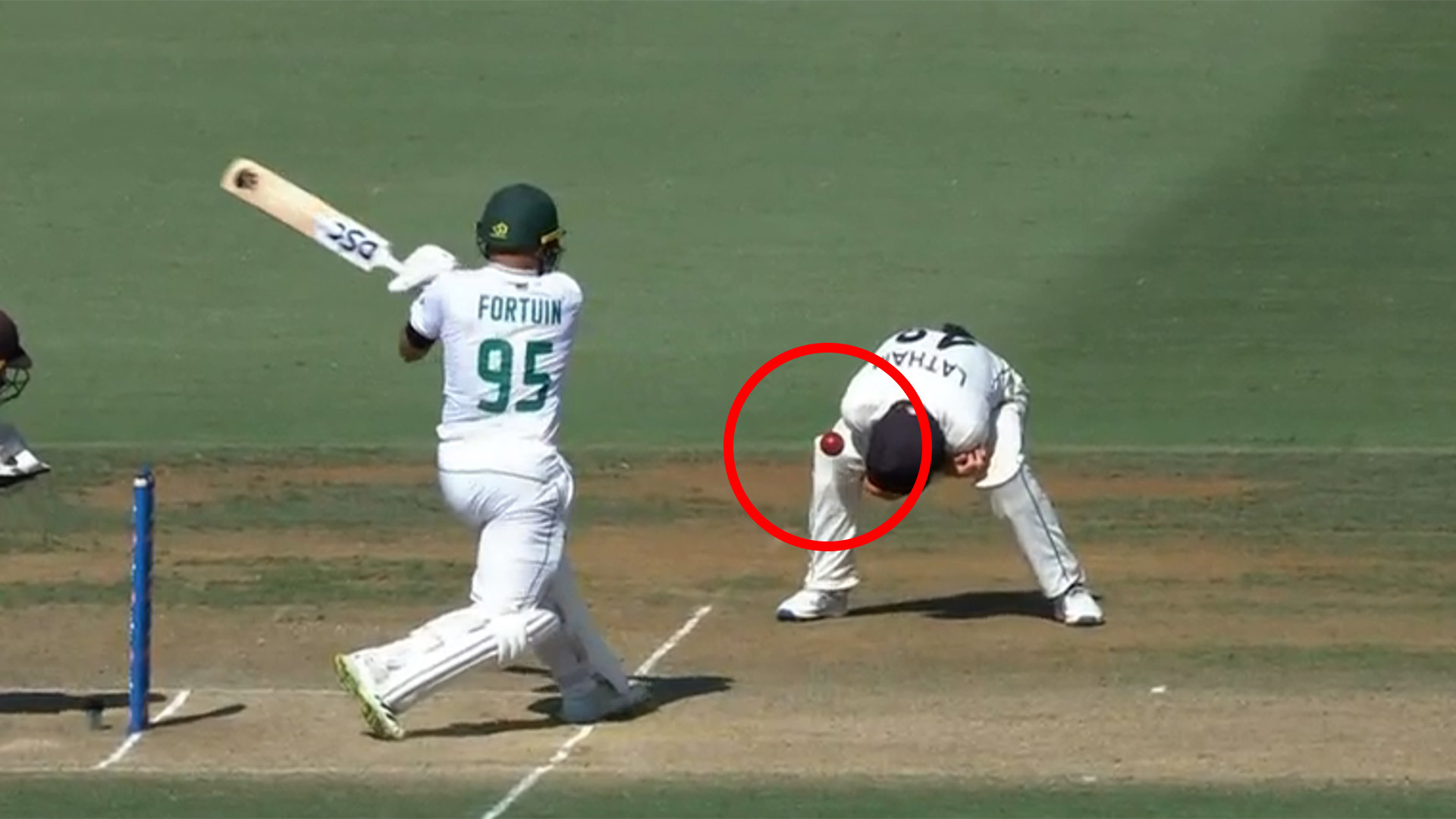 Clyde Fortuin fires the ball into Tom Latham's knee before bouncing into the air and being caught by Tom Blundell.