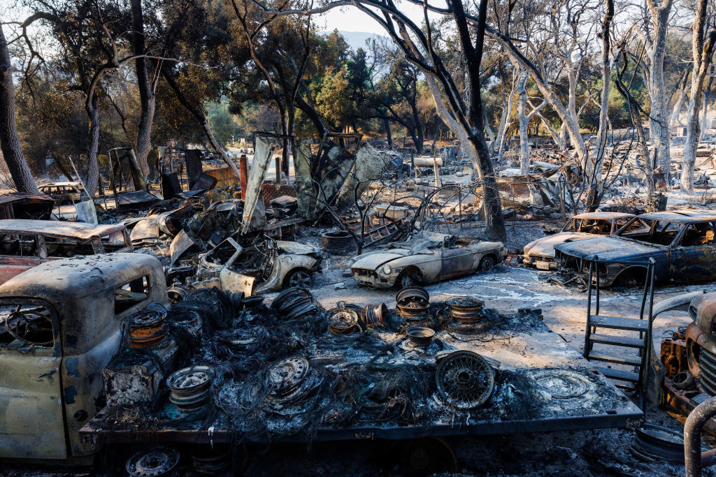 The Airport fire turned a property into a graveyard of torched vintage vehicles next to a destroyed home off Ortega Highway.