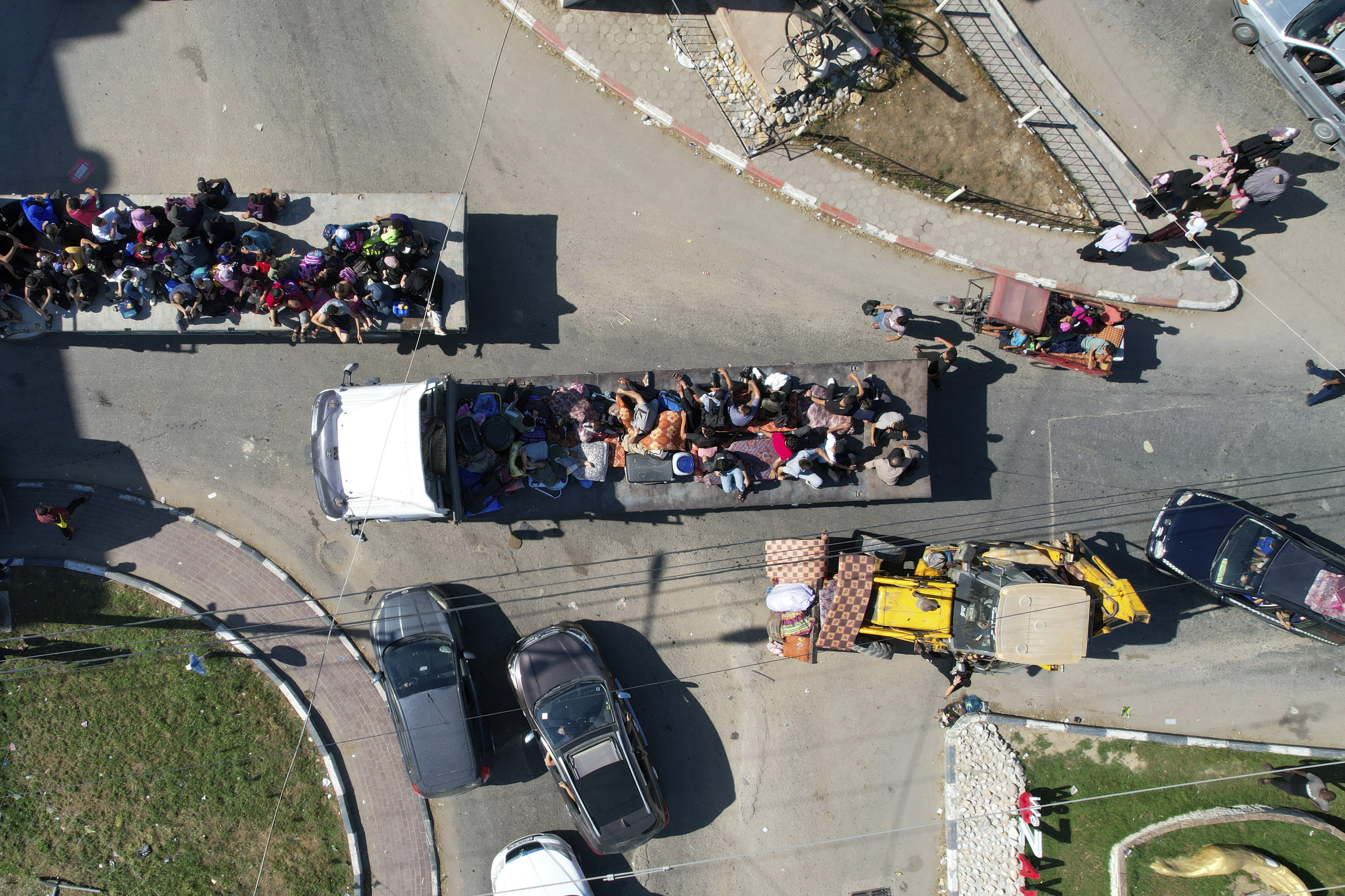 Palestinians flee from northern Gaza to the south after the Israeli army issued an unprecedented evacuation warning to a population of over 1 million people in northern Gaza and Gaza City to seek refuge in the south ahead of a possible Israeli ground invasion, Friday, Oct. 13, 2023.