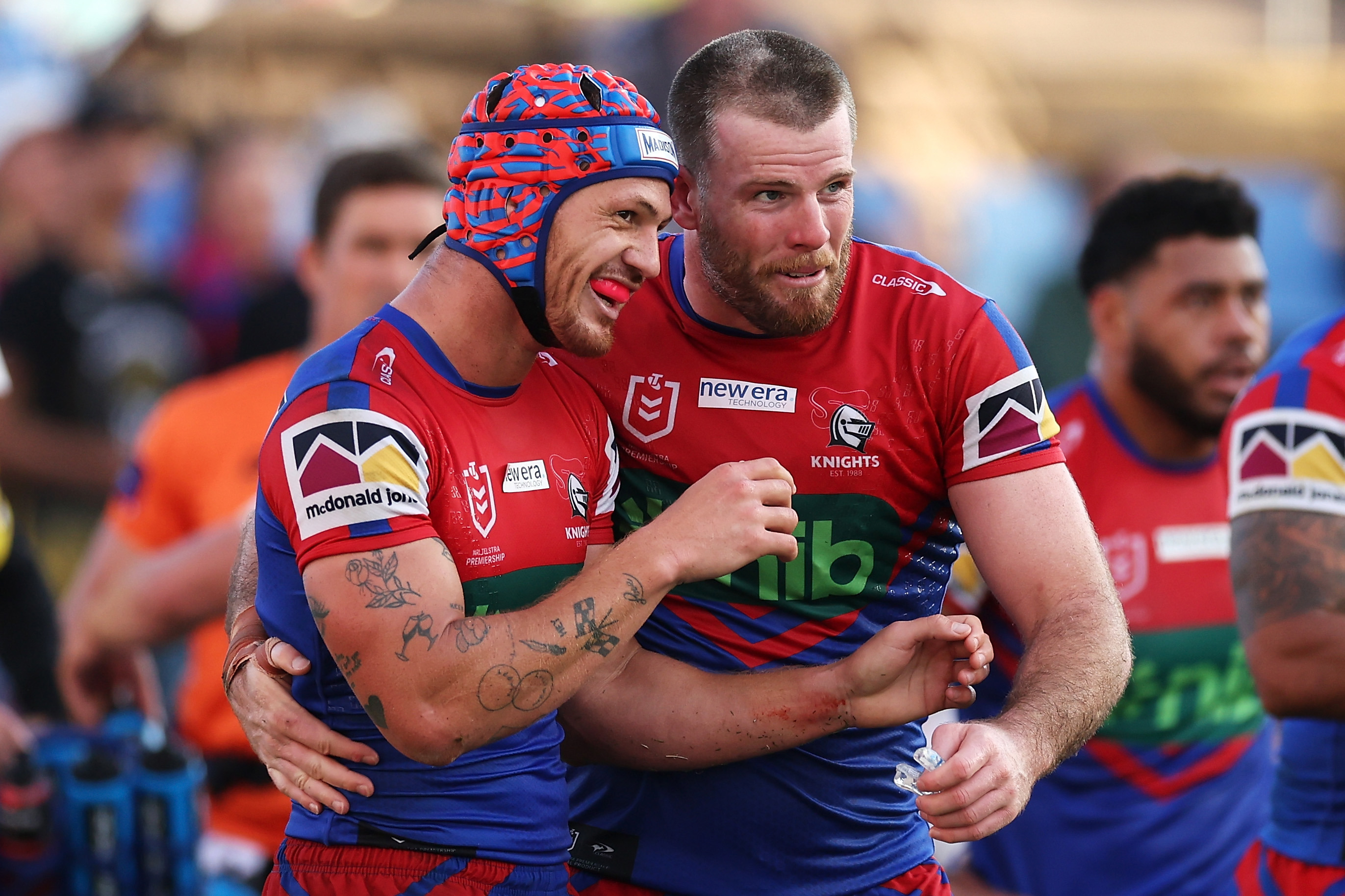 Kalyn Ponga and Lachlan Fitzgibbon of the Knights celebrate a try.