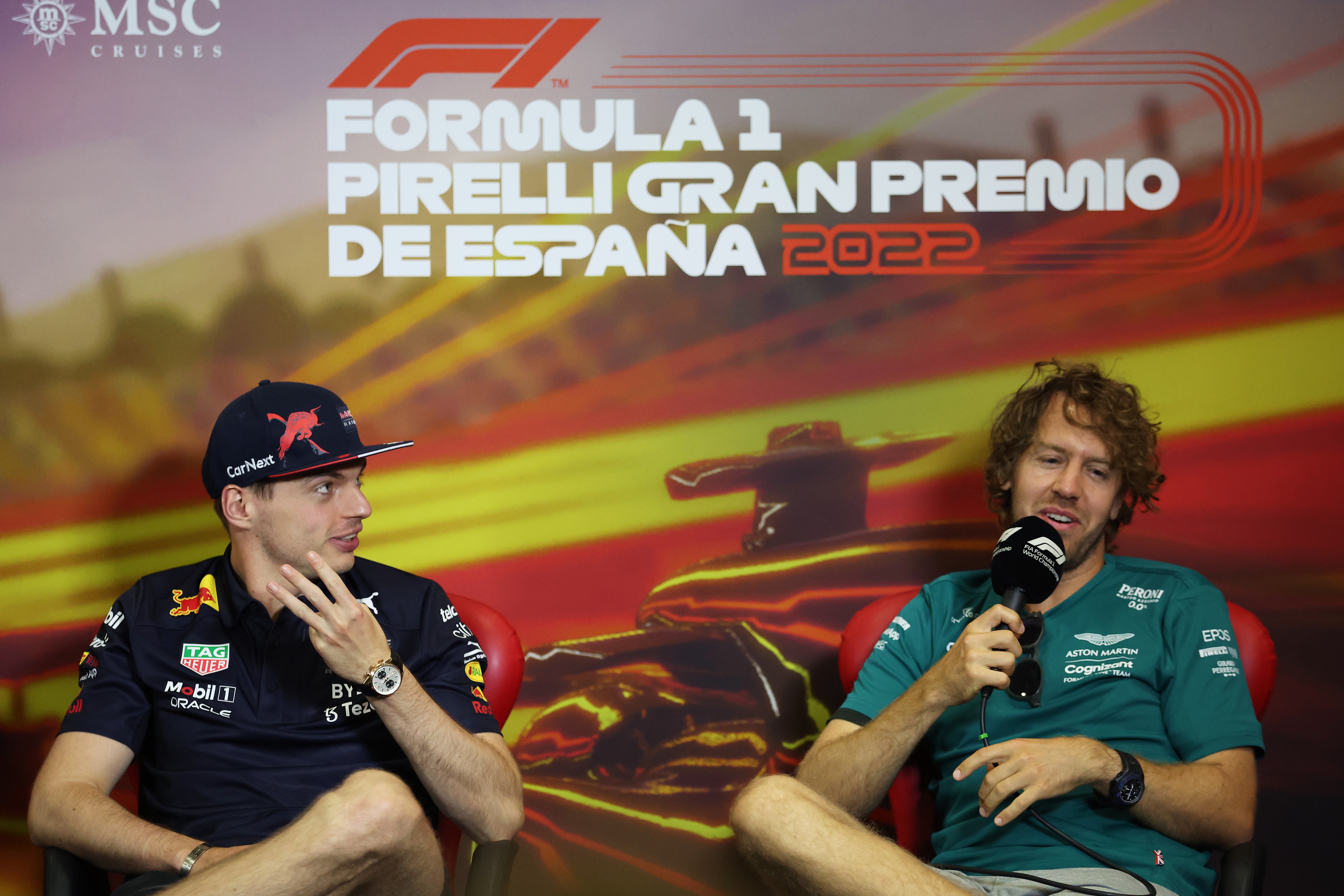 Sebastian Vettel talks in the pre-race press conference next to Max Verstappen ahead of the Spanish Grand Prix.