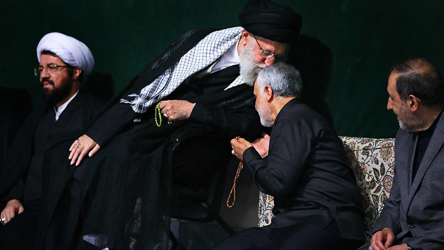 This 2018 photo shows Iran's Supreme Leader Ayatollah Khamenei kissing forehead of Qassem Soleimani, then leader of Iran's elite Quds Force.