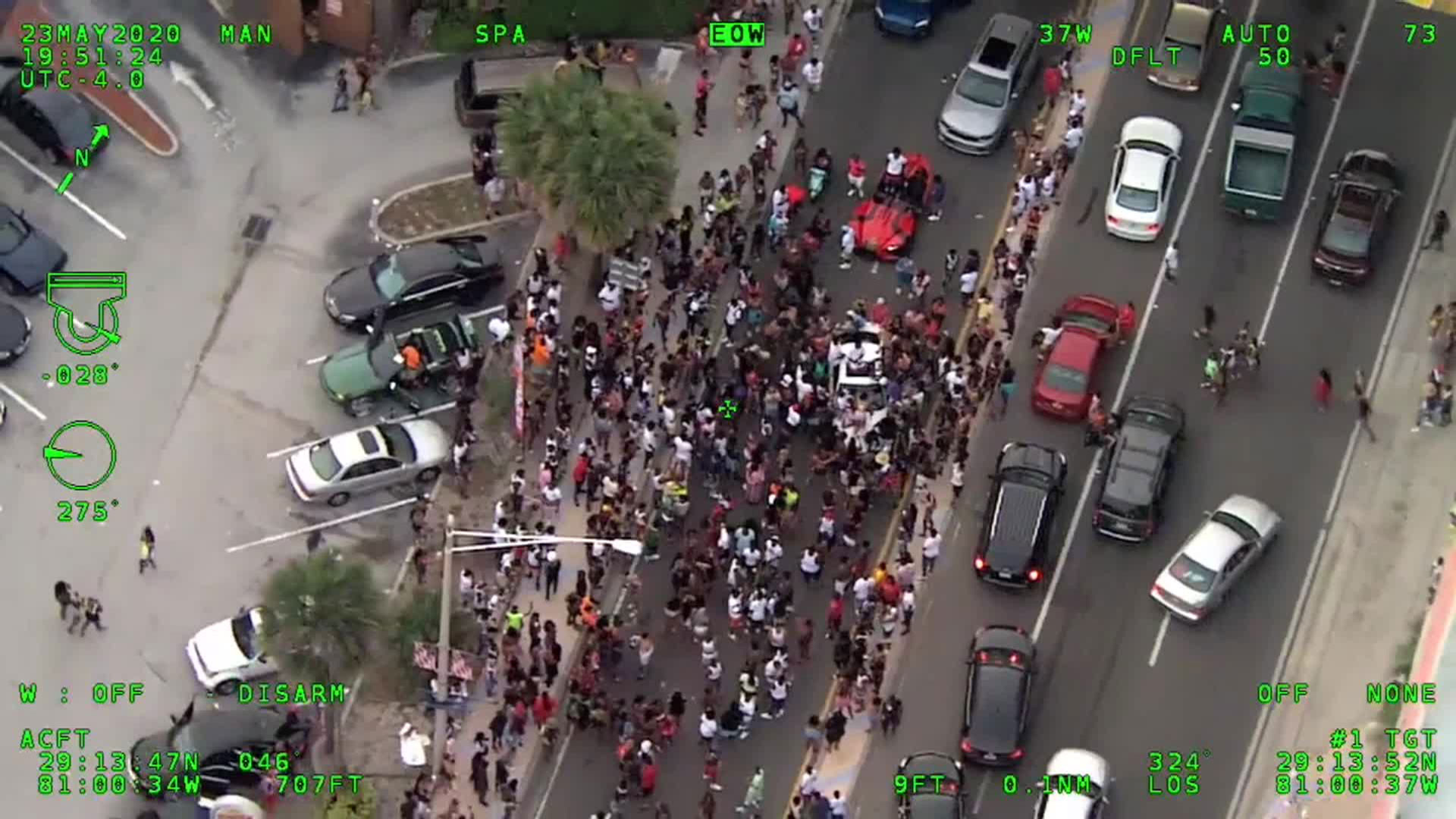 Aerial footage from the Volusia County Sheriff's Office shows large crowds blocking the streets in Daytona Beach