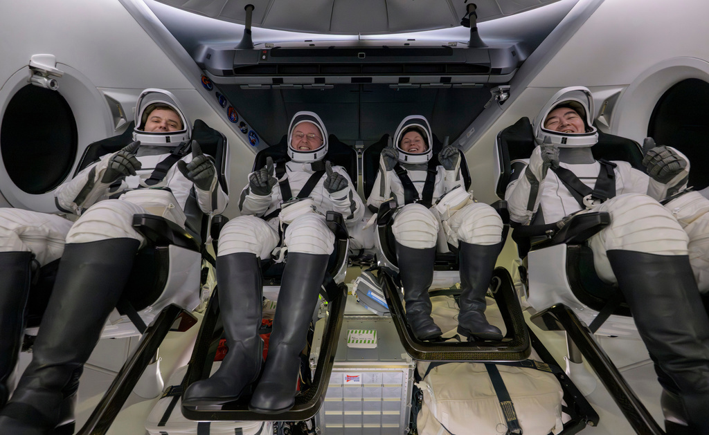 Roscosmos cosmonaut Oleg Platonov, left, NASA astronauts Mike Fincke, Zena Cardman, and JAXA (Japan Aerospace Exploration Agency) astronaut Kimiya Yui are seen inside the SpaceX Dragon Endeavour spacecraft
