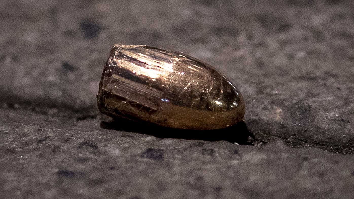 A bullet lies on the ground after a mass shooting in Hanau, Germany.