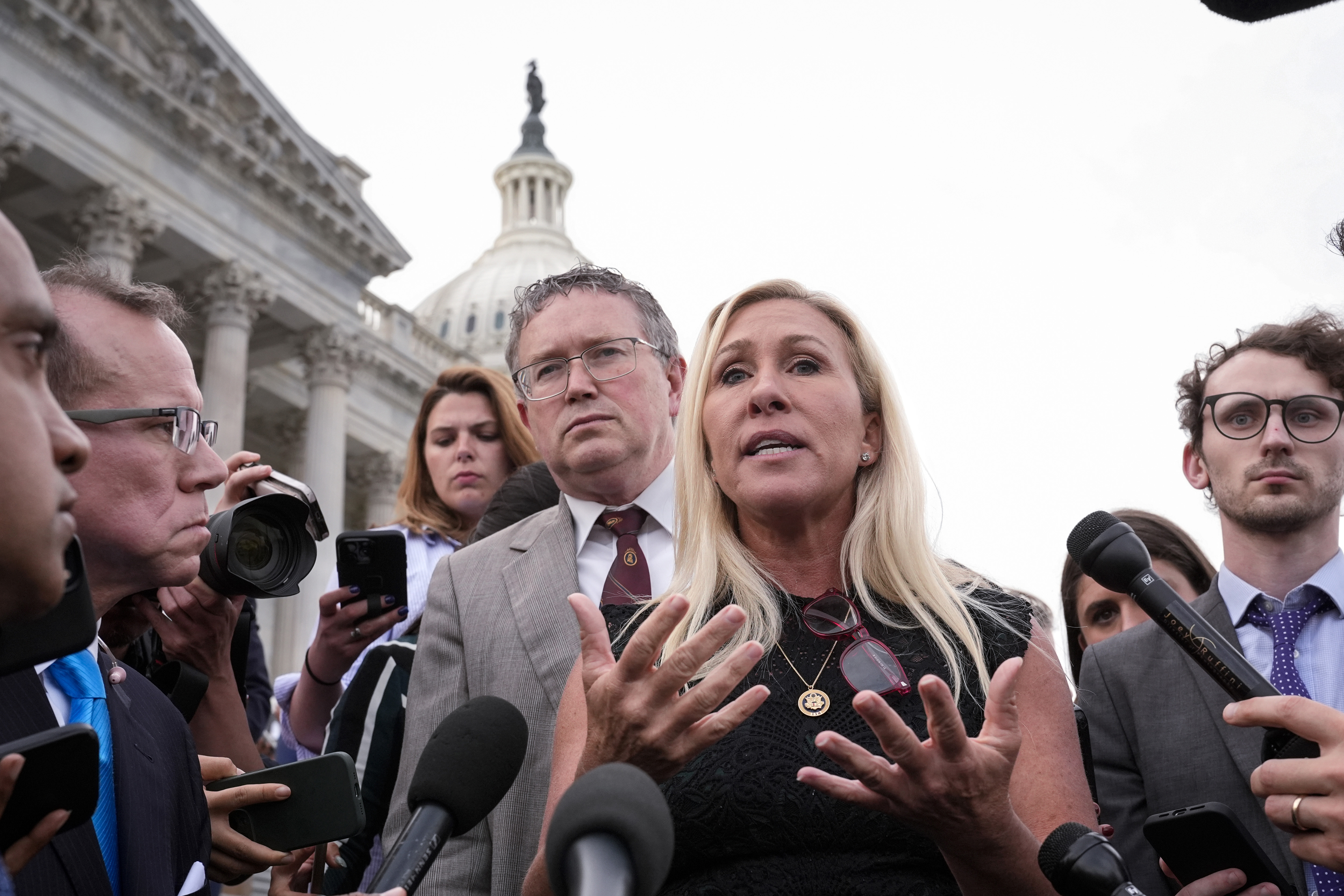 Thomas Massie (left) and Marjorie Taylor Greene (right).