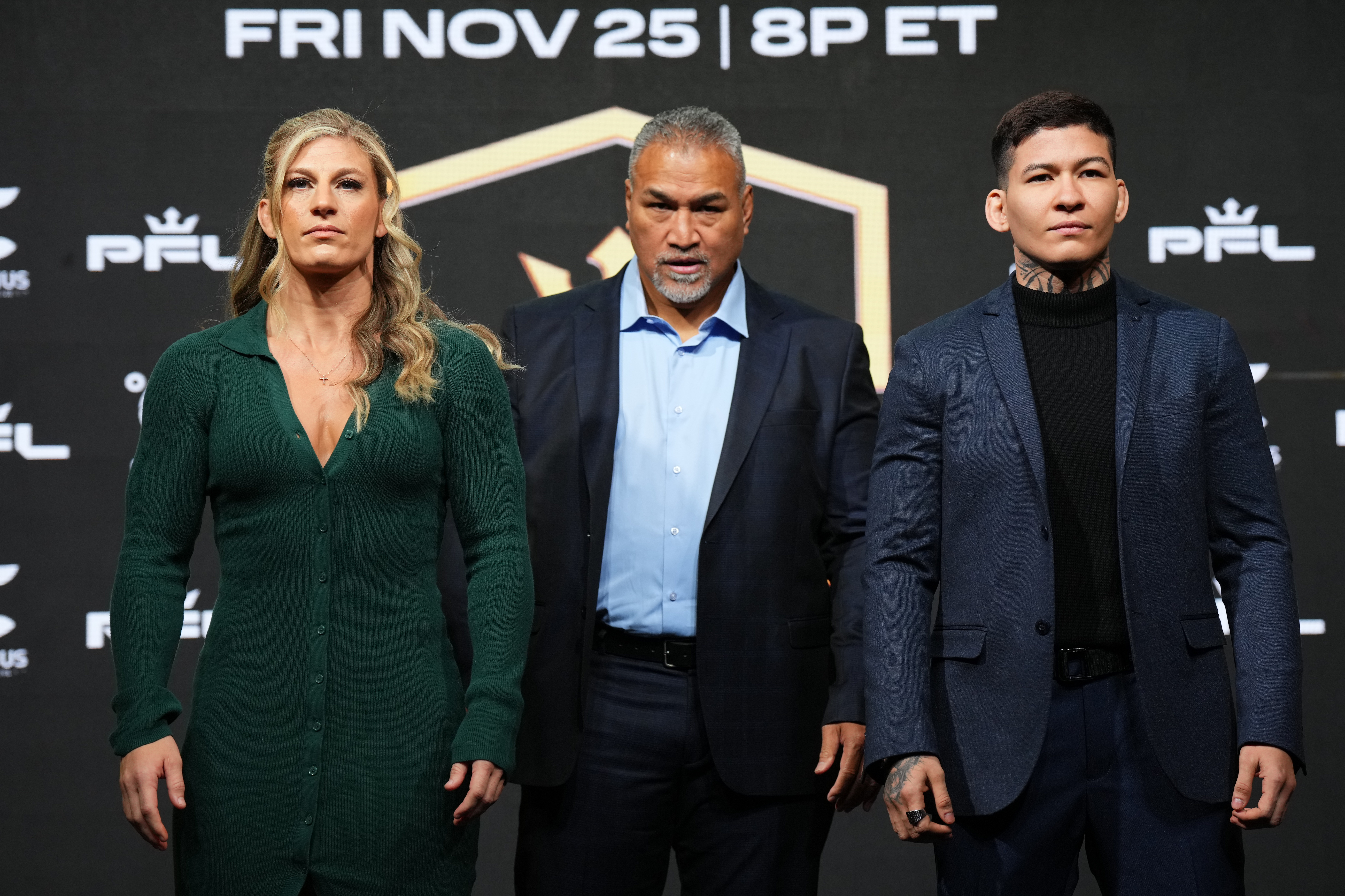 Kayla Harrison (left) at the pre-fight press conference with Larissa Pacheco (right).