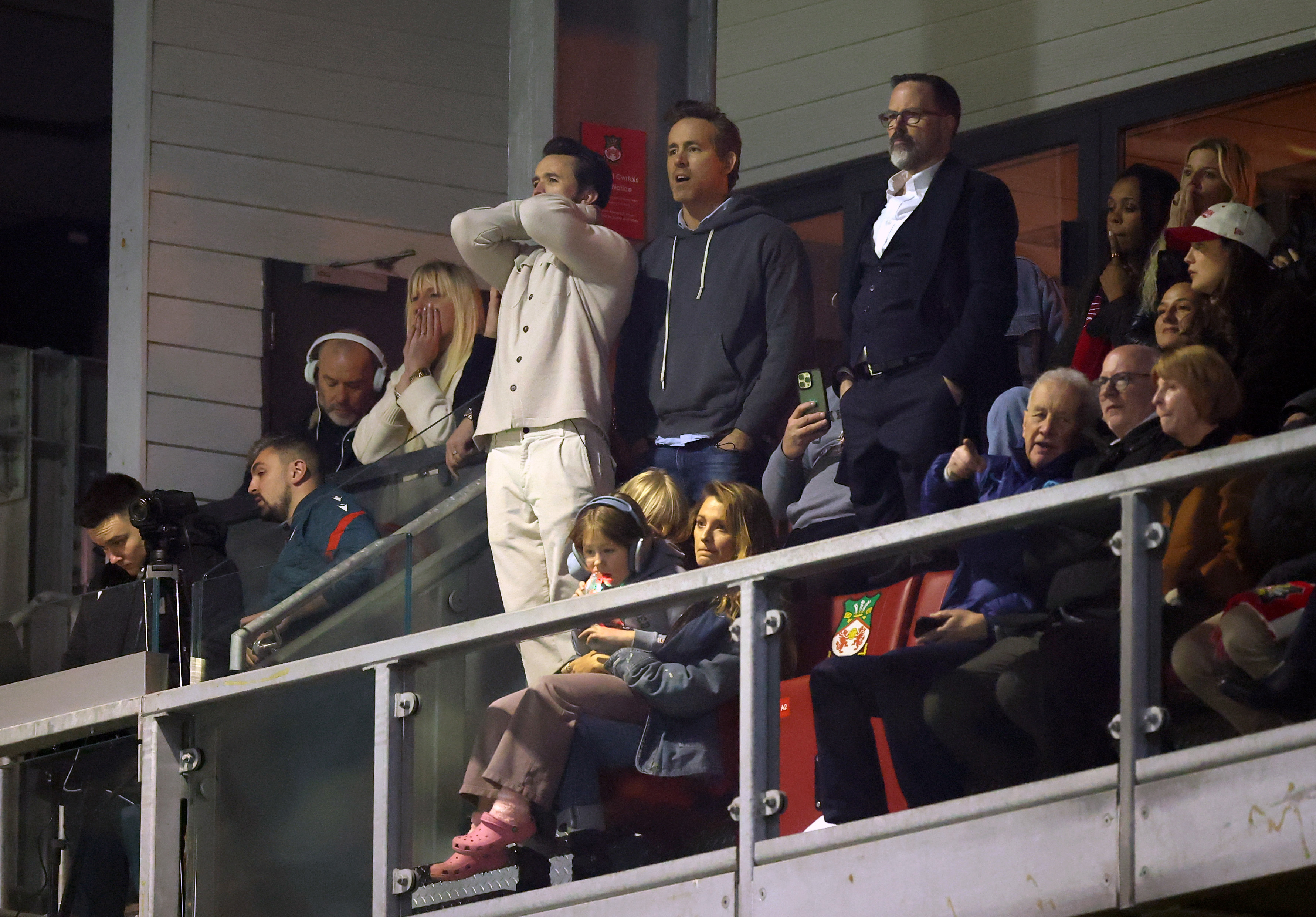 WREXHAM, WALES - MARCH 07: Rob McElhenney, Actor and Co-Owner of Wrexham, Ryan Reynolds, Actor and Co-Owner of Wrexham, and Actress Blake Lively react during the Emirates FA Cup Fifth Round match between Wrexham and Chelsea on March 07, 2026 in Wrexham, Wales. (Photo by Carl Recine/Getty Images)