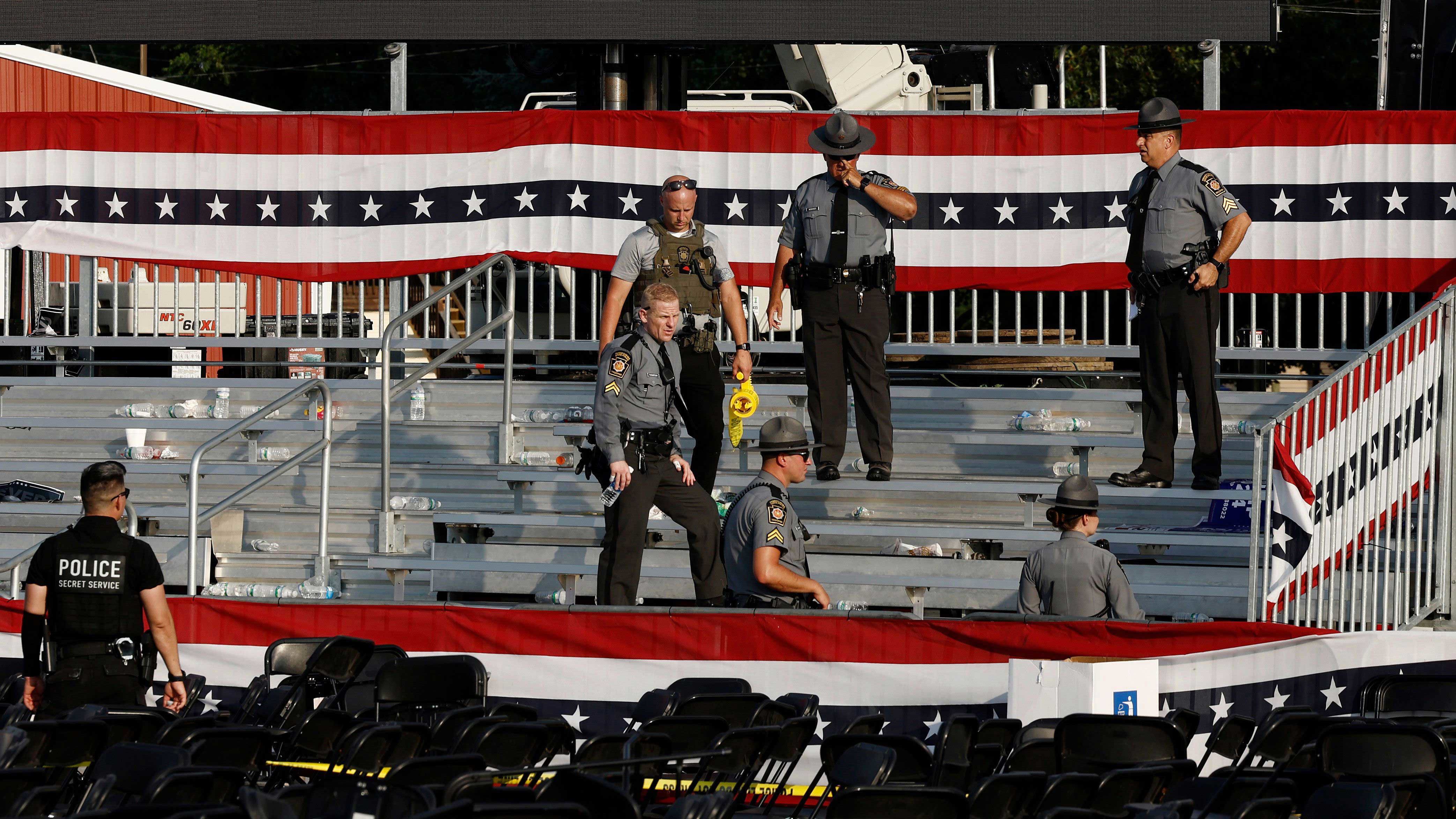 Law enforcement agents pictured near the stage of a campaign rally for Republican presidential candidate former President Donald Trump on July 13, in Butler, Pennsylvania.