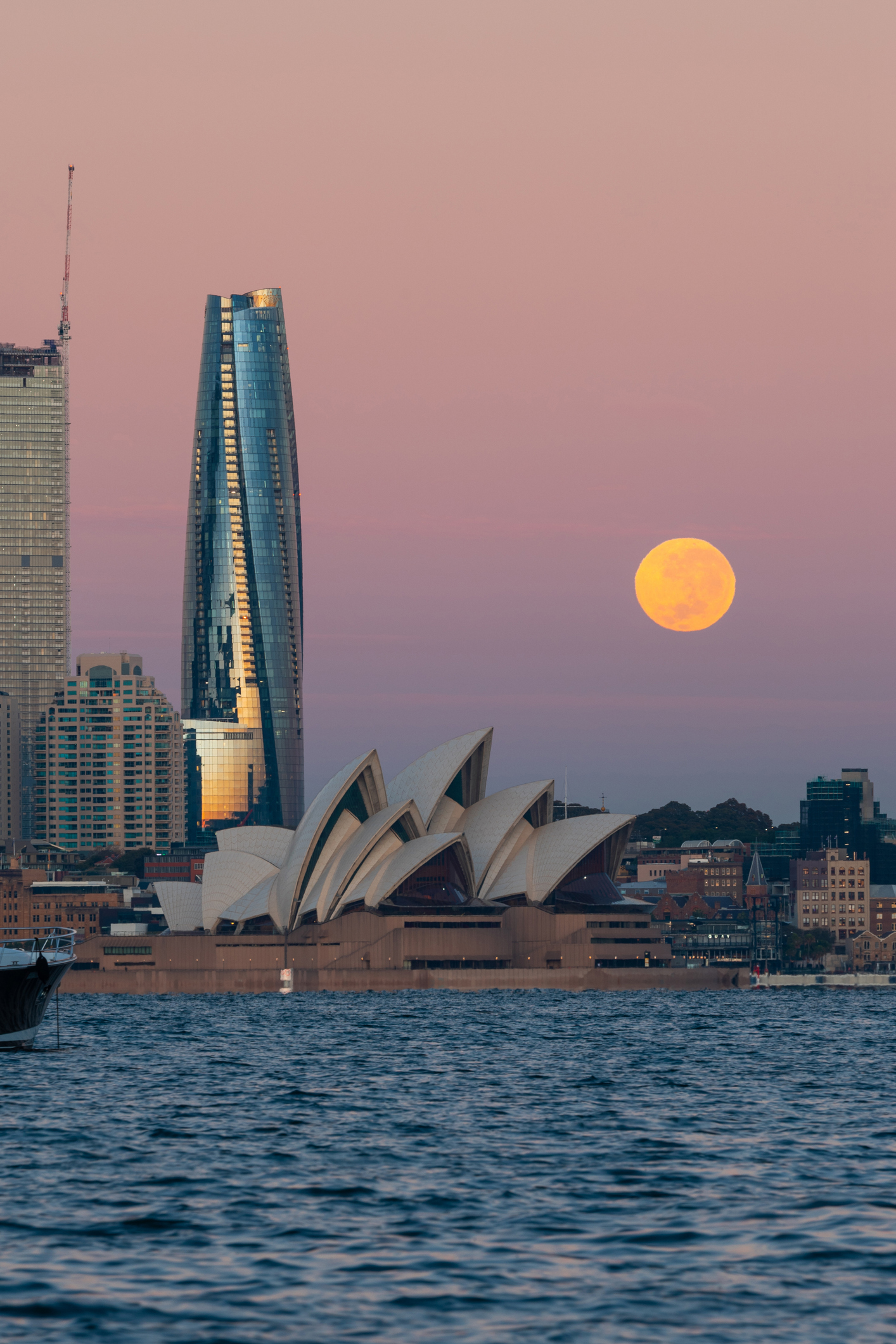 Sydney, Australia - May 6, 2023: Moonset view over Sydney Harbour.