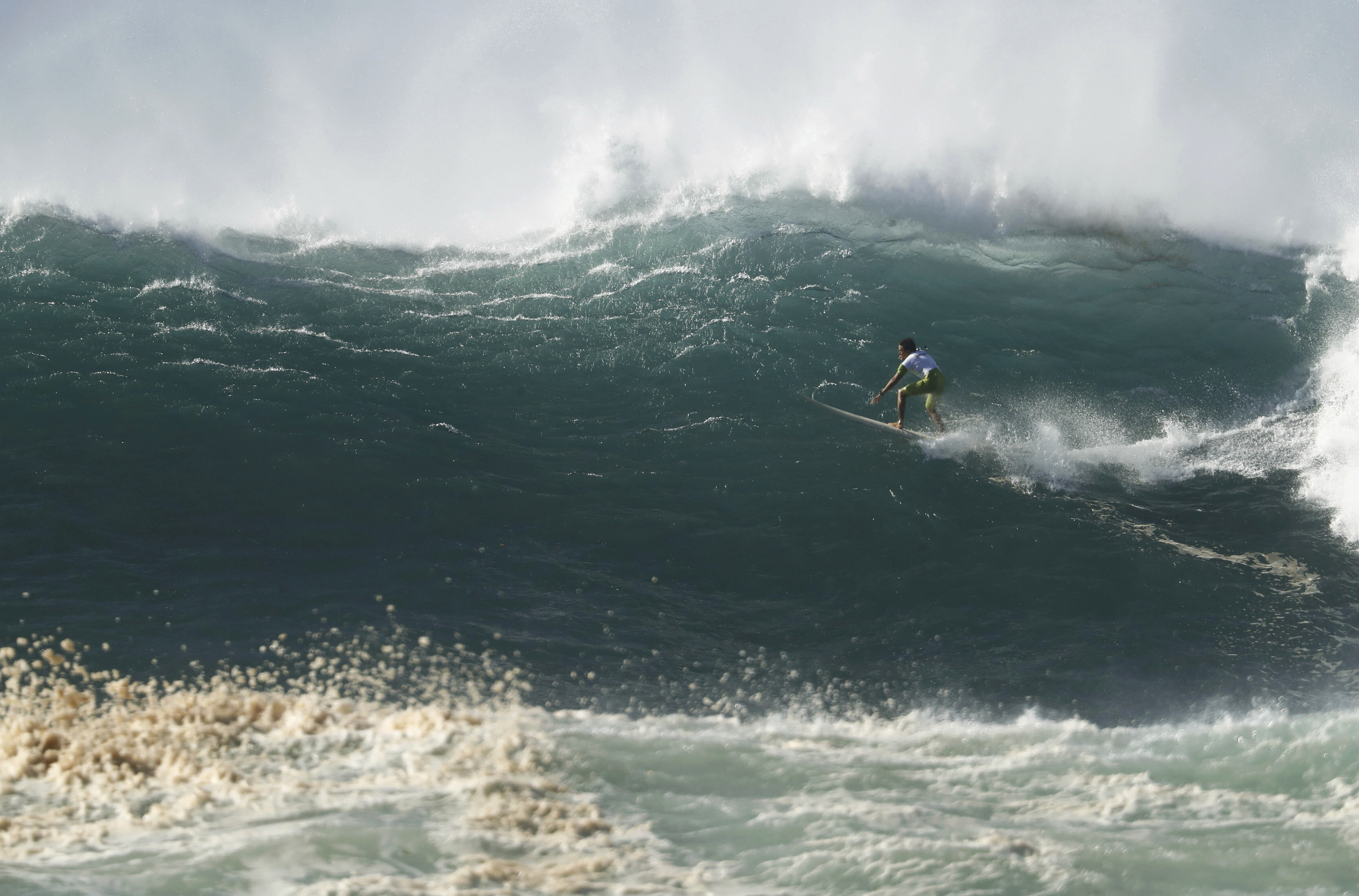 Luke Shepardson rides a colossal wave during The Eddie Aikau Big Wave Invitational.