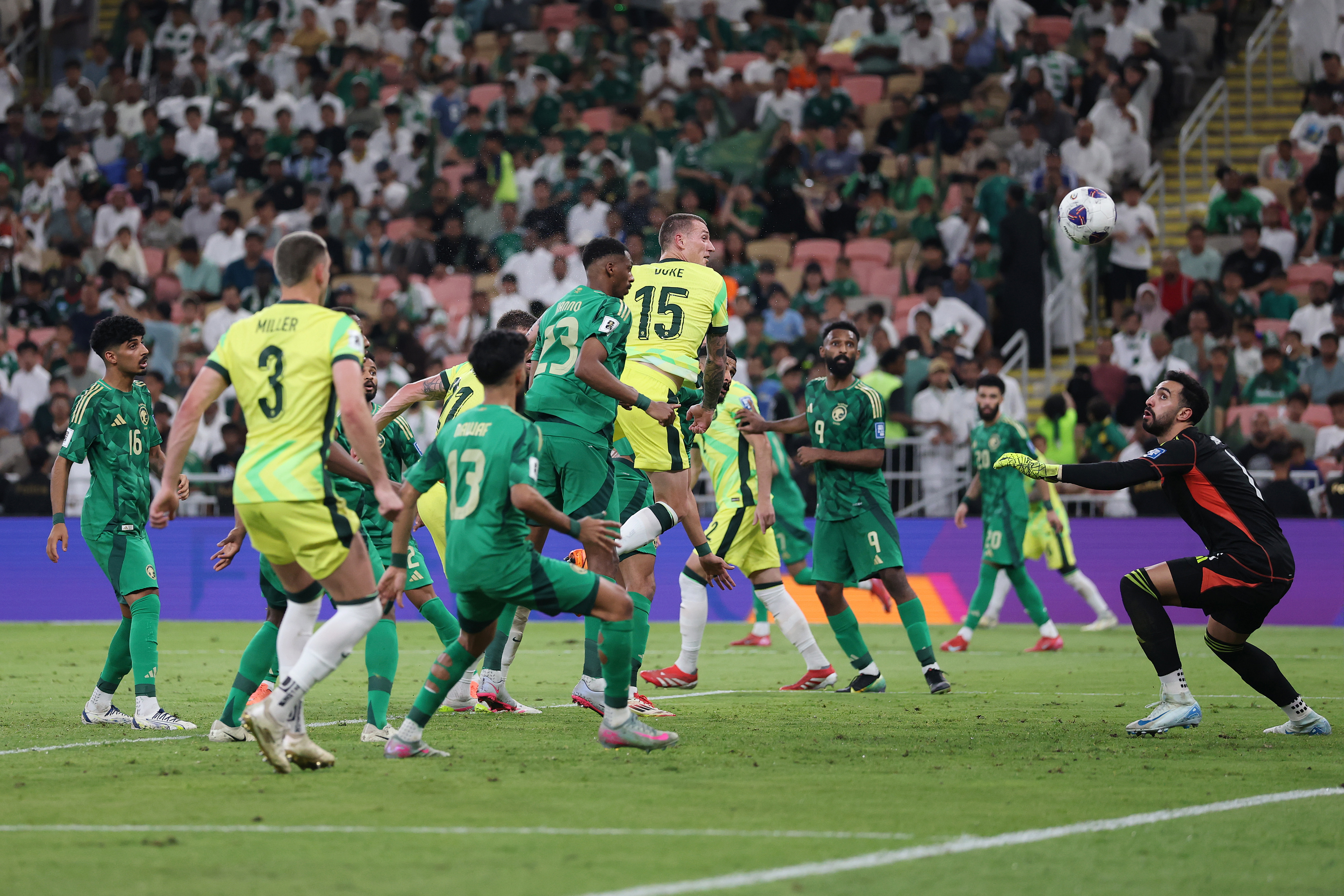 Mitch Duke of Australia scores his team's second goal.