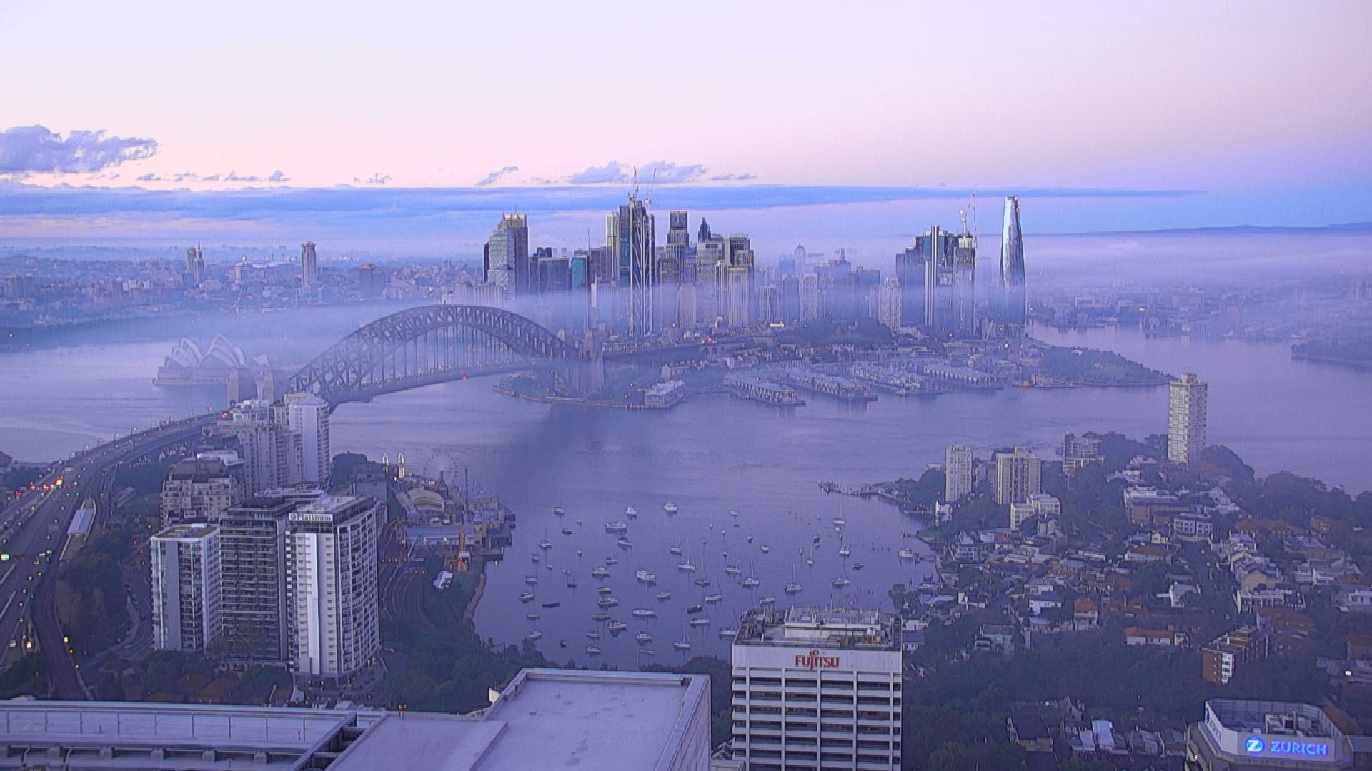 Like a second city above the clouds, Sydney skyscrapers poked through the heavy fog that blanketed the city. 