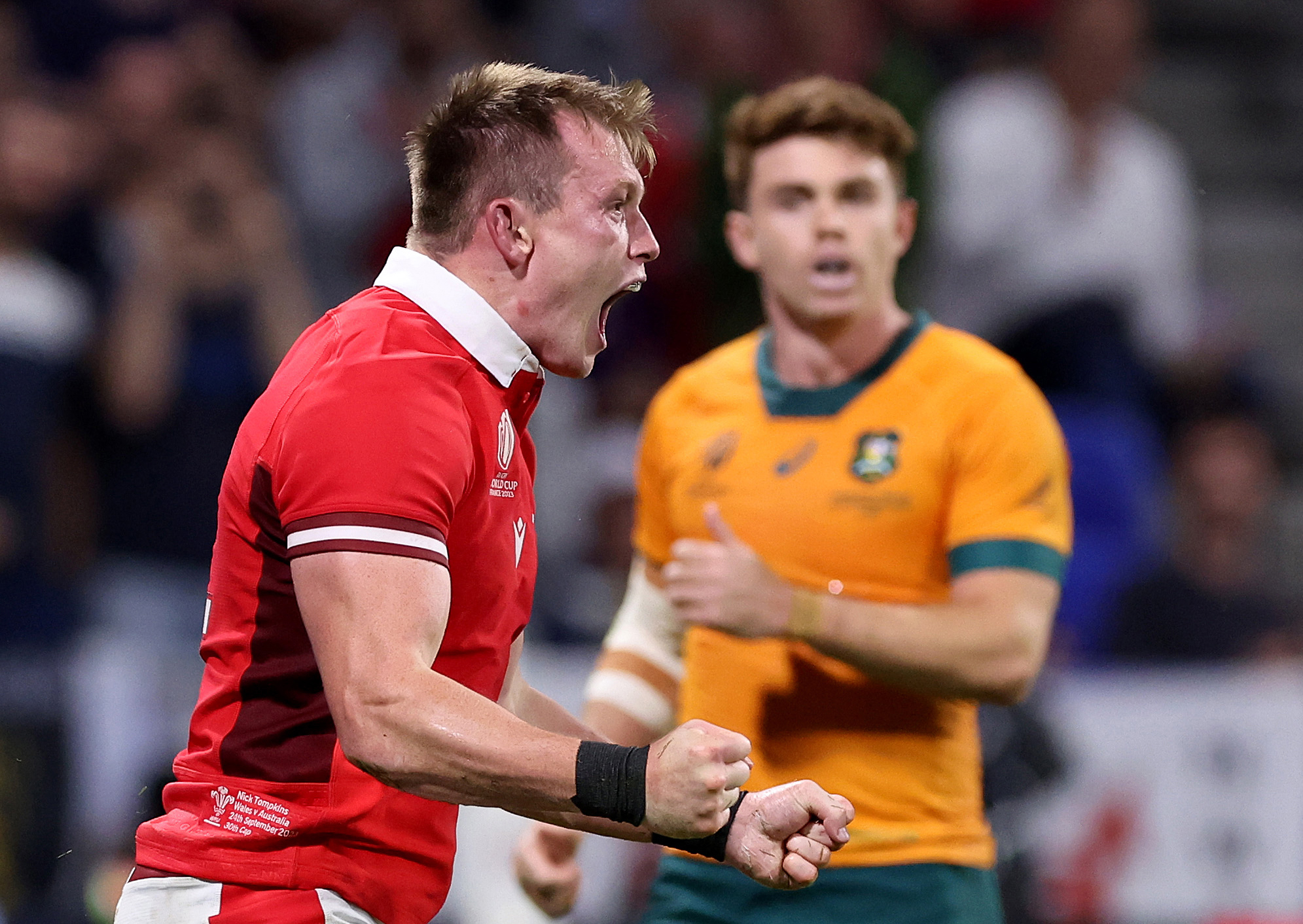 Nick Tompkins of Wales celebrates scoring his team's second try during the Rugby World Cup in Lyon.