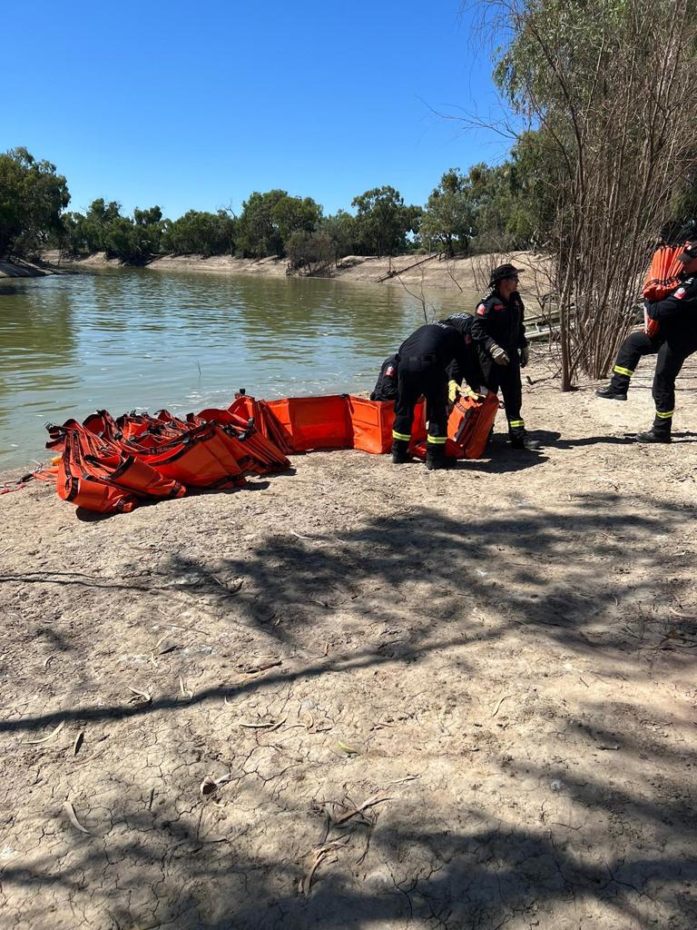 NSW Police clear dead fish from Main Weir Pool in Menindee.