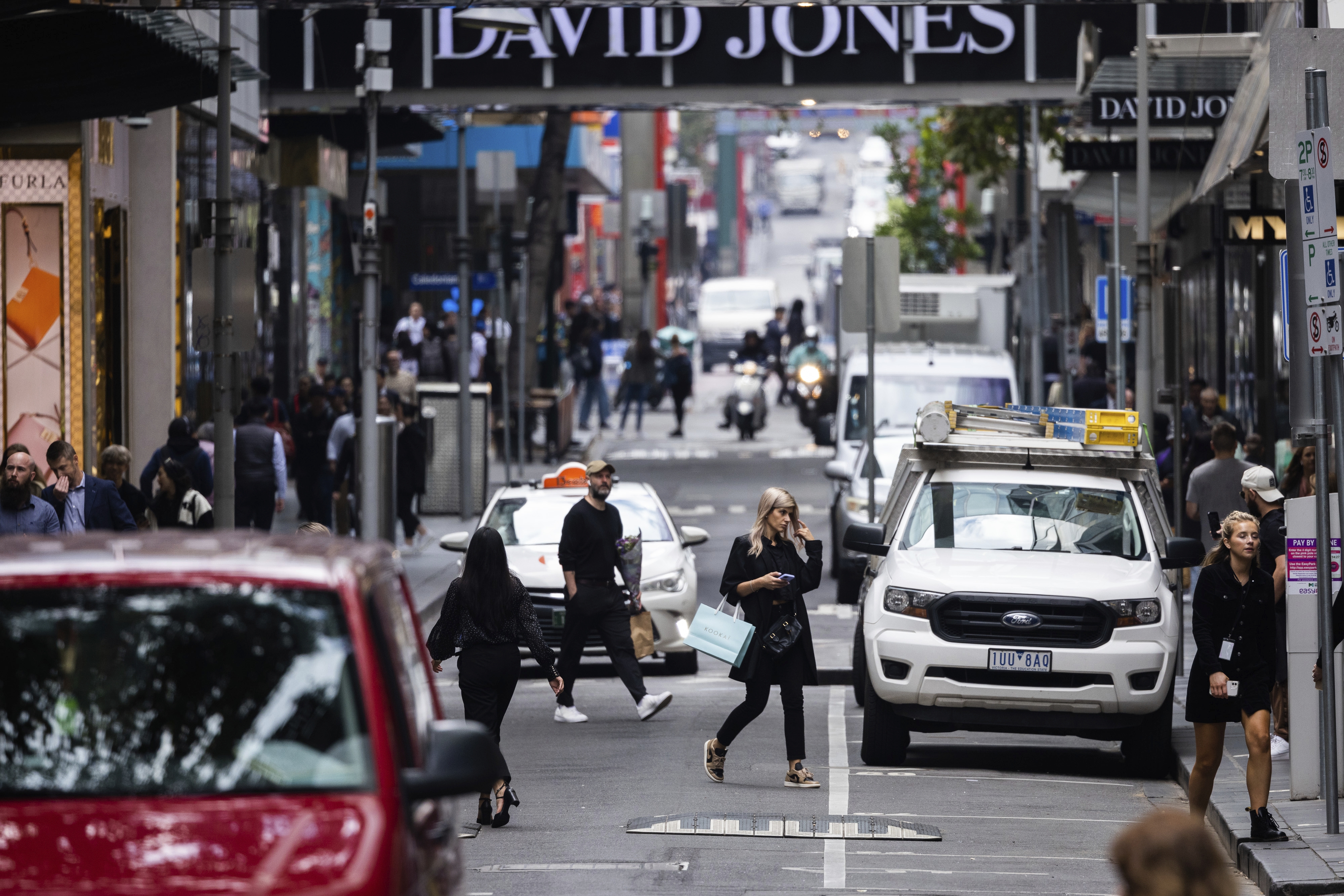 Pedestrians on Little Bourke Street in Melbourne
