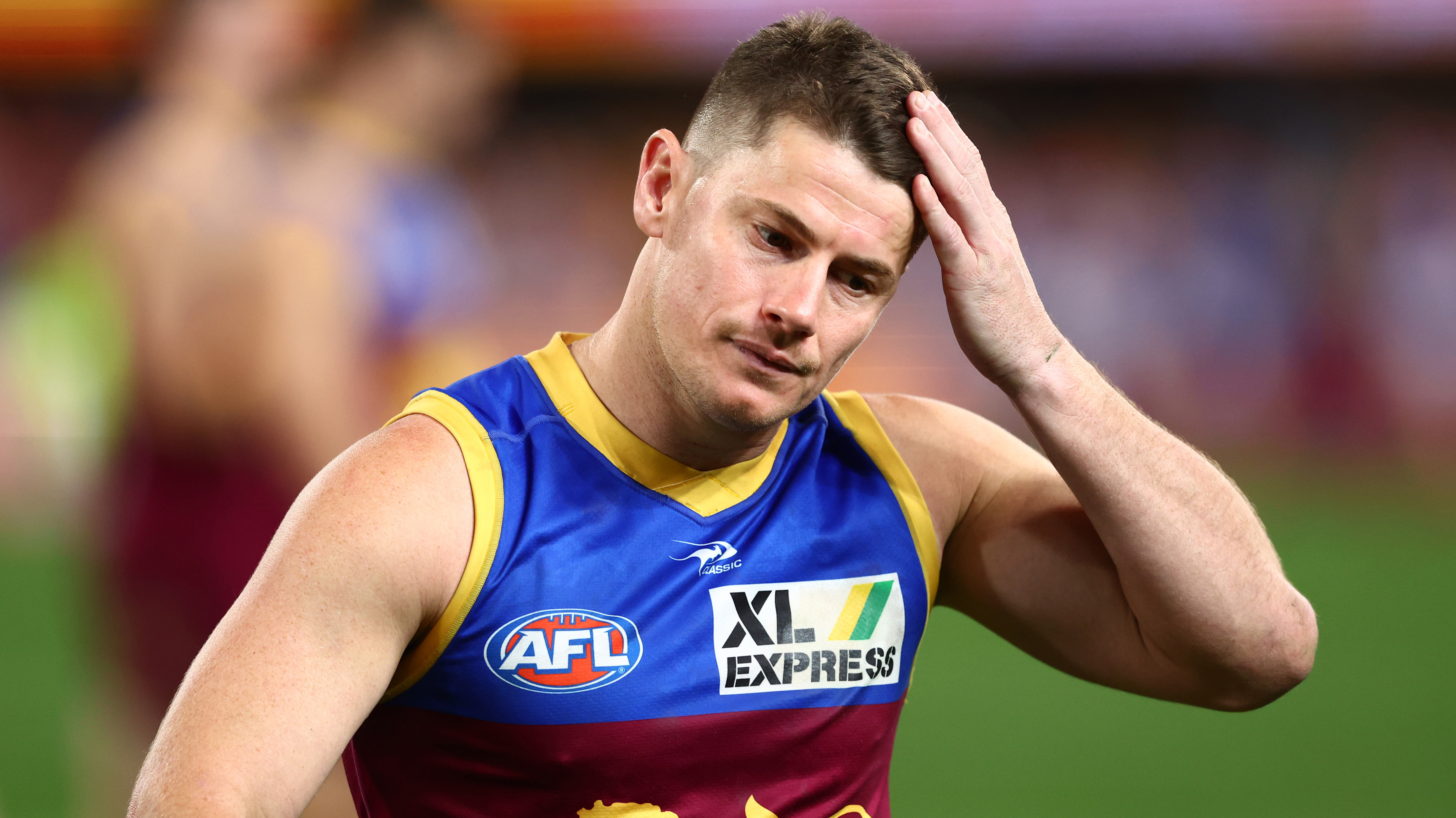 Dayne Zorko of the Lions leaves the field after losing the round 23 AFL match between the Brisbane Lions and the Melbourne Demons at The Gabba on August 19, 2022 in Brisbane, Australia. (Photo by Chris Hyde/Getty Images)