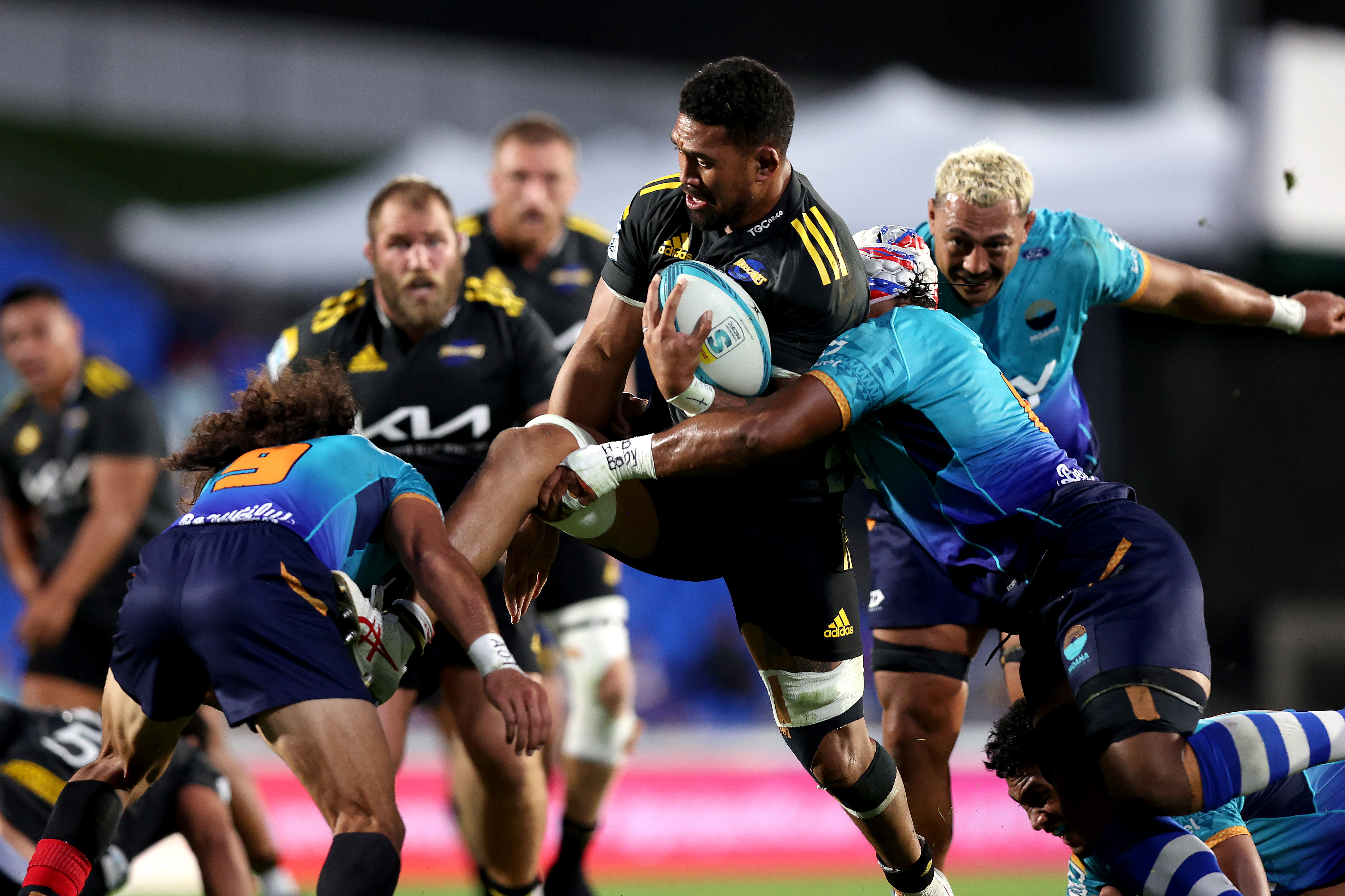 Ardie Savea of the Hurricanes is tackled.