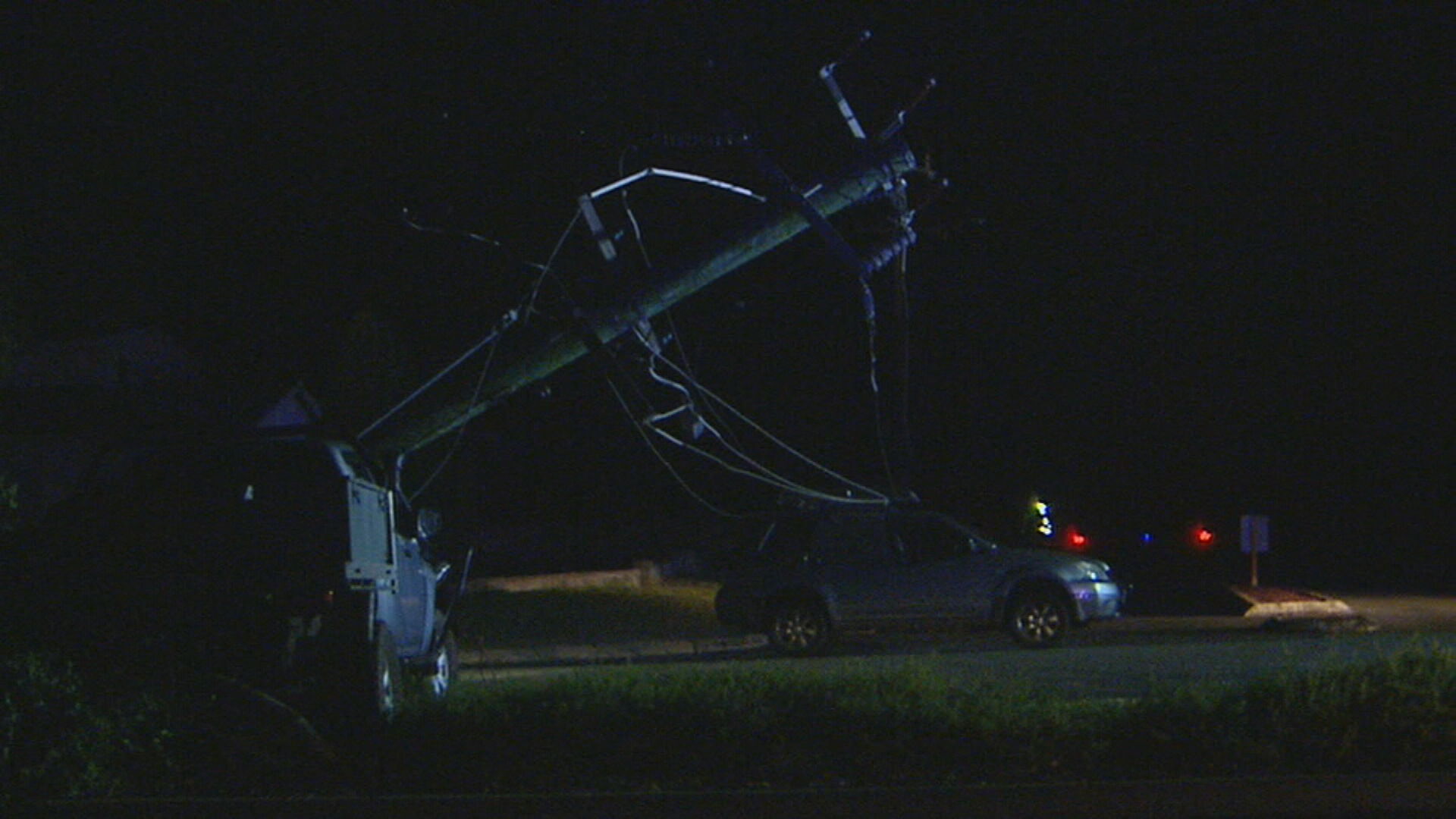 The female driver and her young son were trapped in their car under live powerlines for 30 minutes.