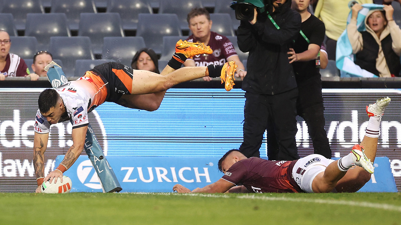 Charlie Staines of the Wests Tigers scores a try during the round eight NRL match between Wests Tigers and Manly Sea Eagles at Campbelltown Stadium on April 23, 2023 in Sydney, Australia. (Photo by Mark Kolbe/Getty Images)